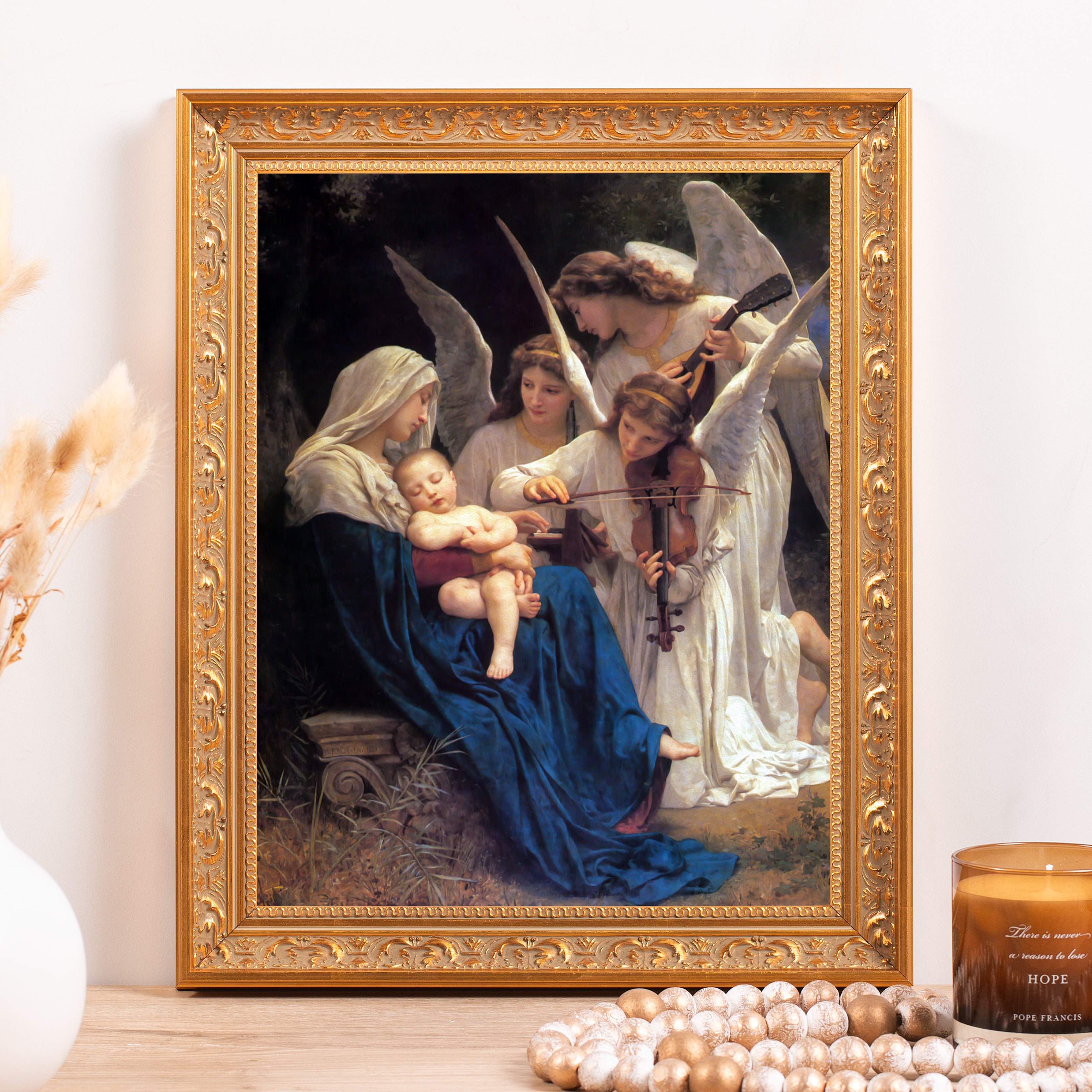 Framed "Song of the Angels" print with a gold ornate border shows mother and child with angels.
