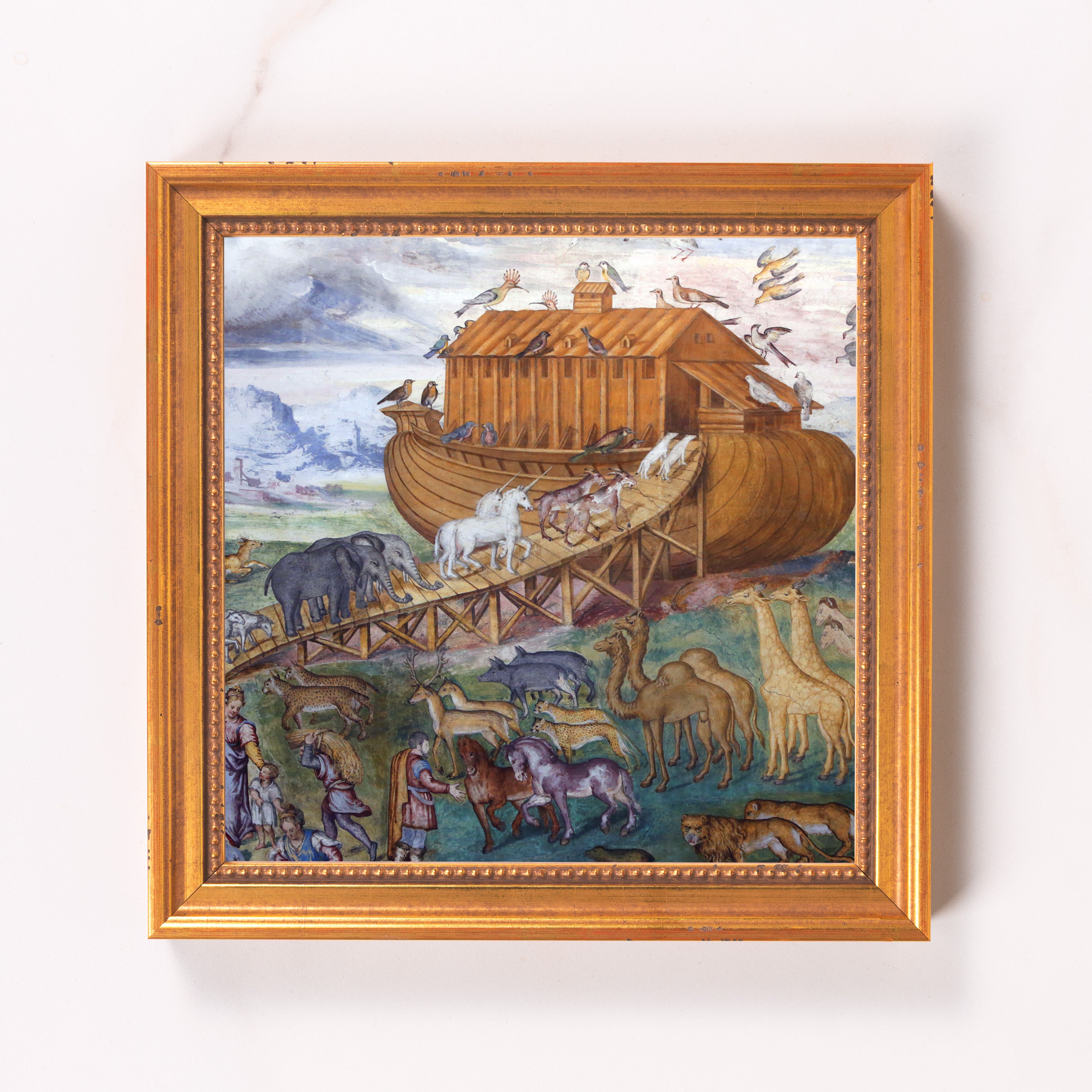 Framed Noah's Ark print shows animals entering the ark in an ornate gold frame.