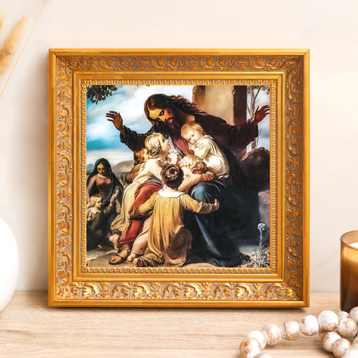 Framed print of Jesus surrounded by children, in a decorative gold frame.