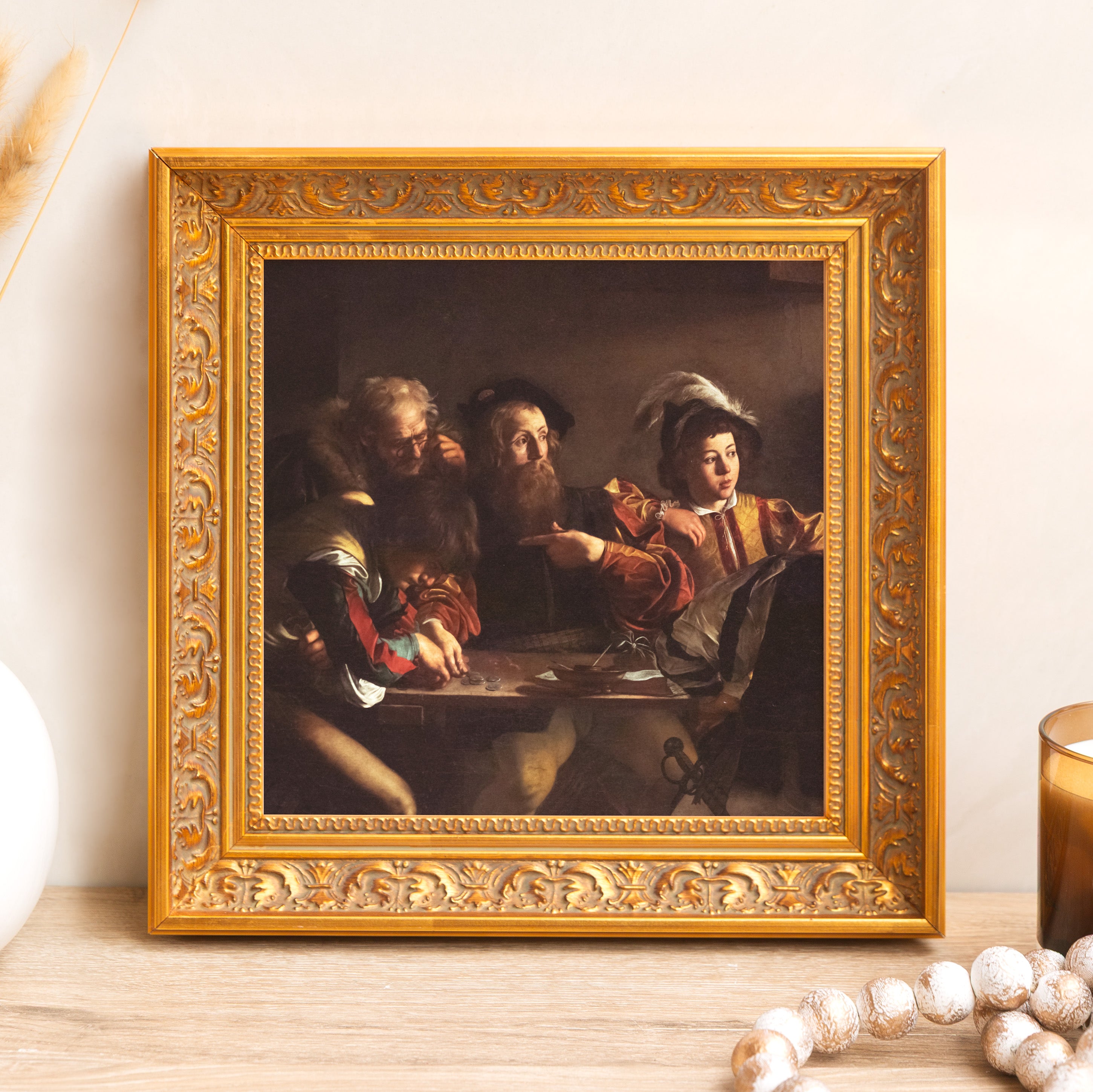 Framed "The Cardsharps" print. Ornate gold frame, classic style for wall decor.