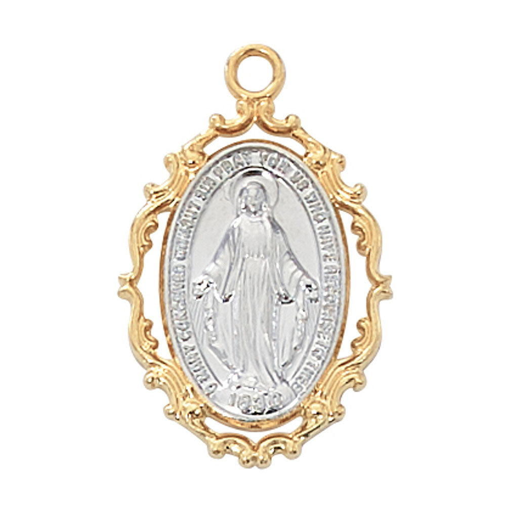 Religious pendant showing Mary in silver, with a gold ornate frame and bail.