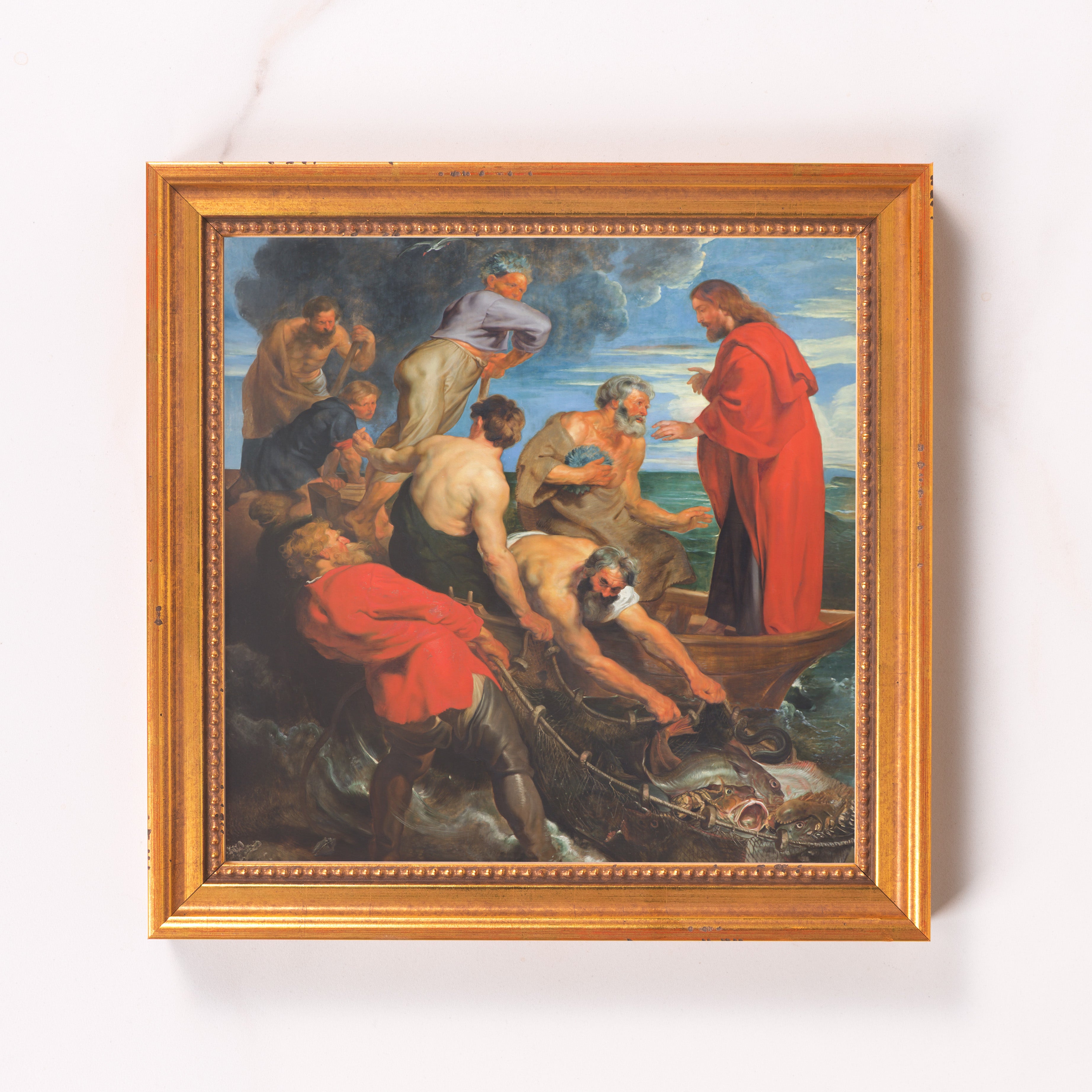 Framed art depicting Jesus' miraculous catch in a gold frame with a classic style.