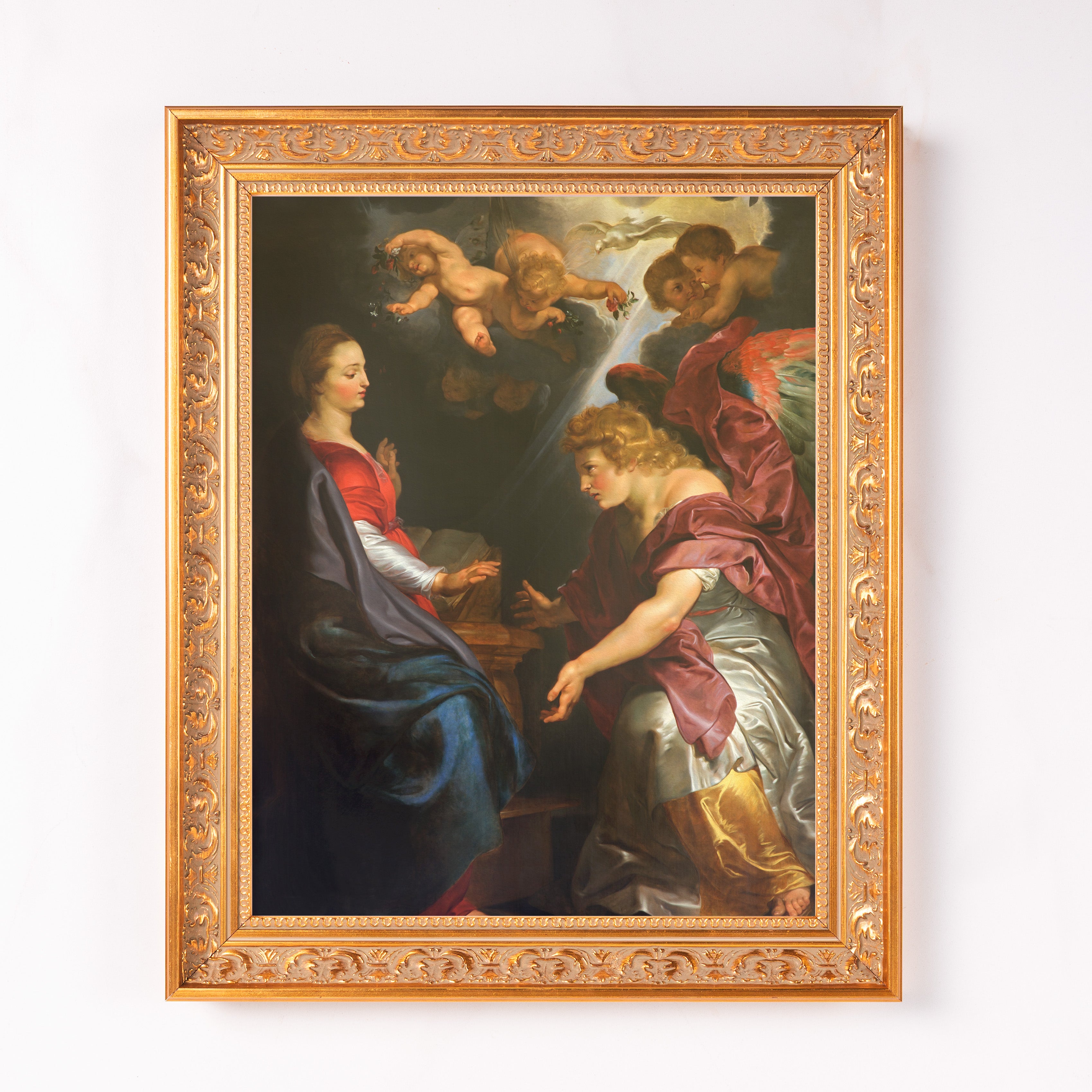 Framed Annunciation print. Painting of biblical scene with gold ornate frame.