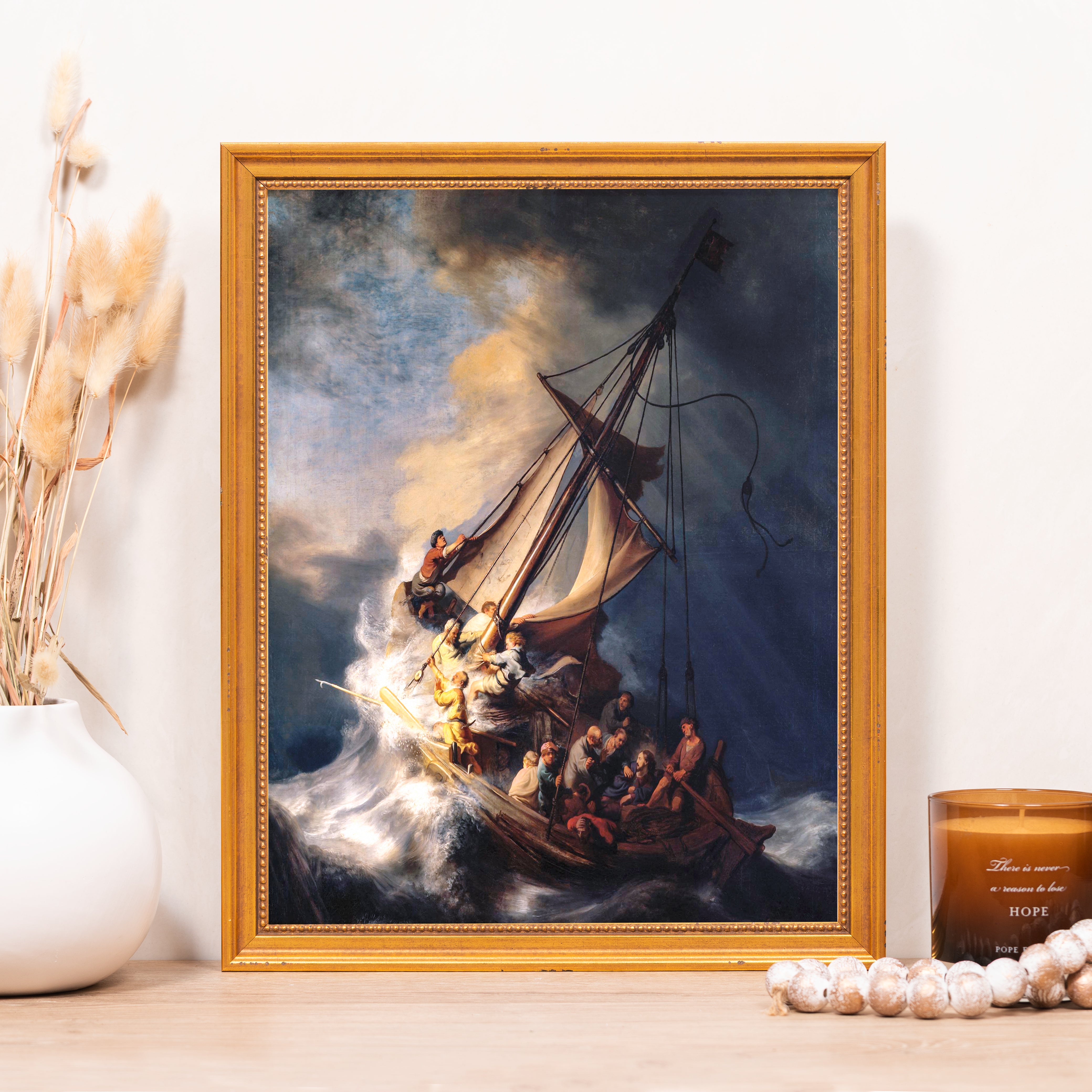 Framed Canvas print of “Christ in the Storm on the Sea of Galilee” with a gold frame, depicting figures in a storm-tossed boat.