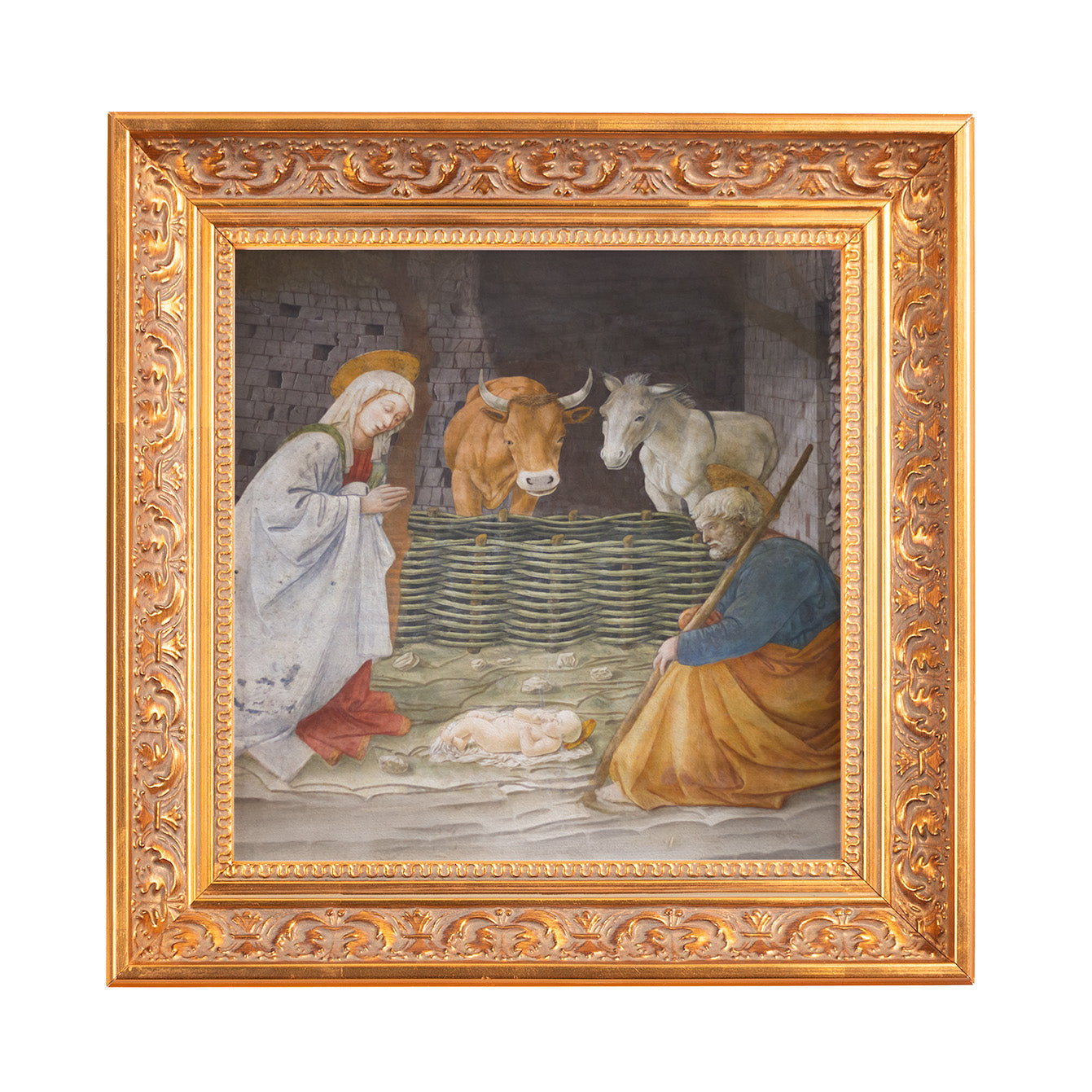 Framed Nativity painting shows Mary, Joseph, baby Jesus, ox, and donkey, in a gilded frame.