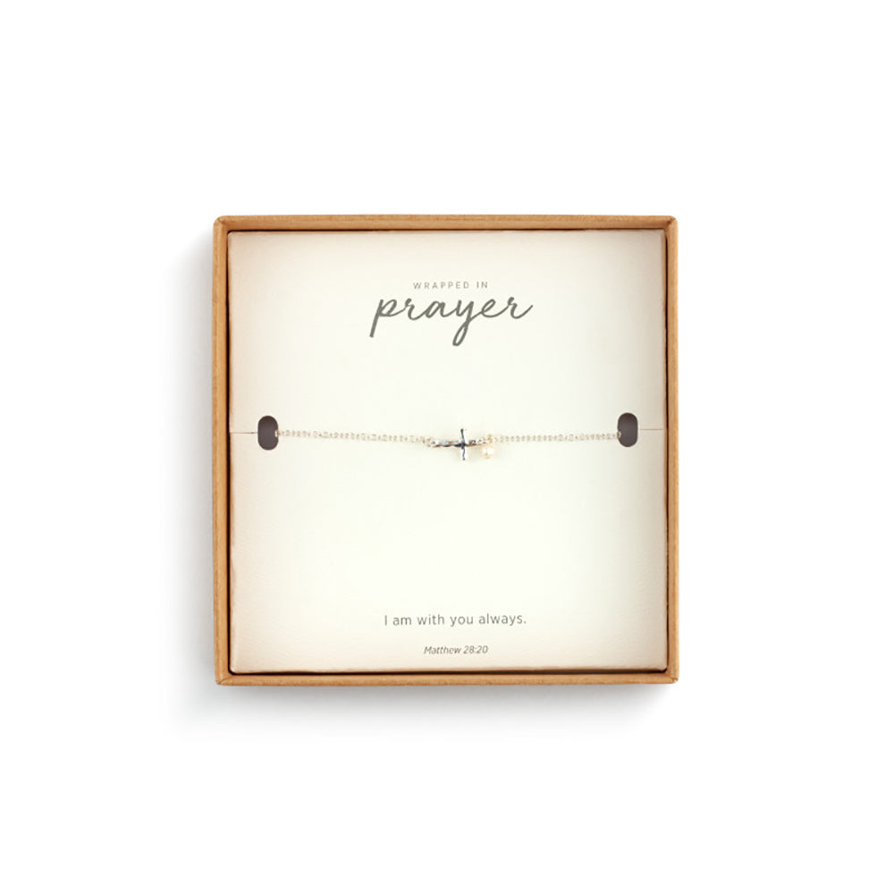 Wrapped bracelet, silver chain with cross and pearl charm, displayed in "Wrapped in Prayer" box.