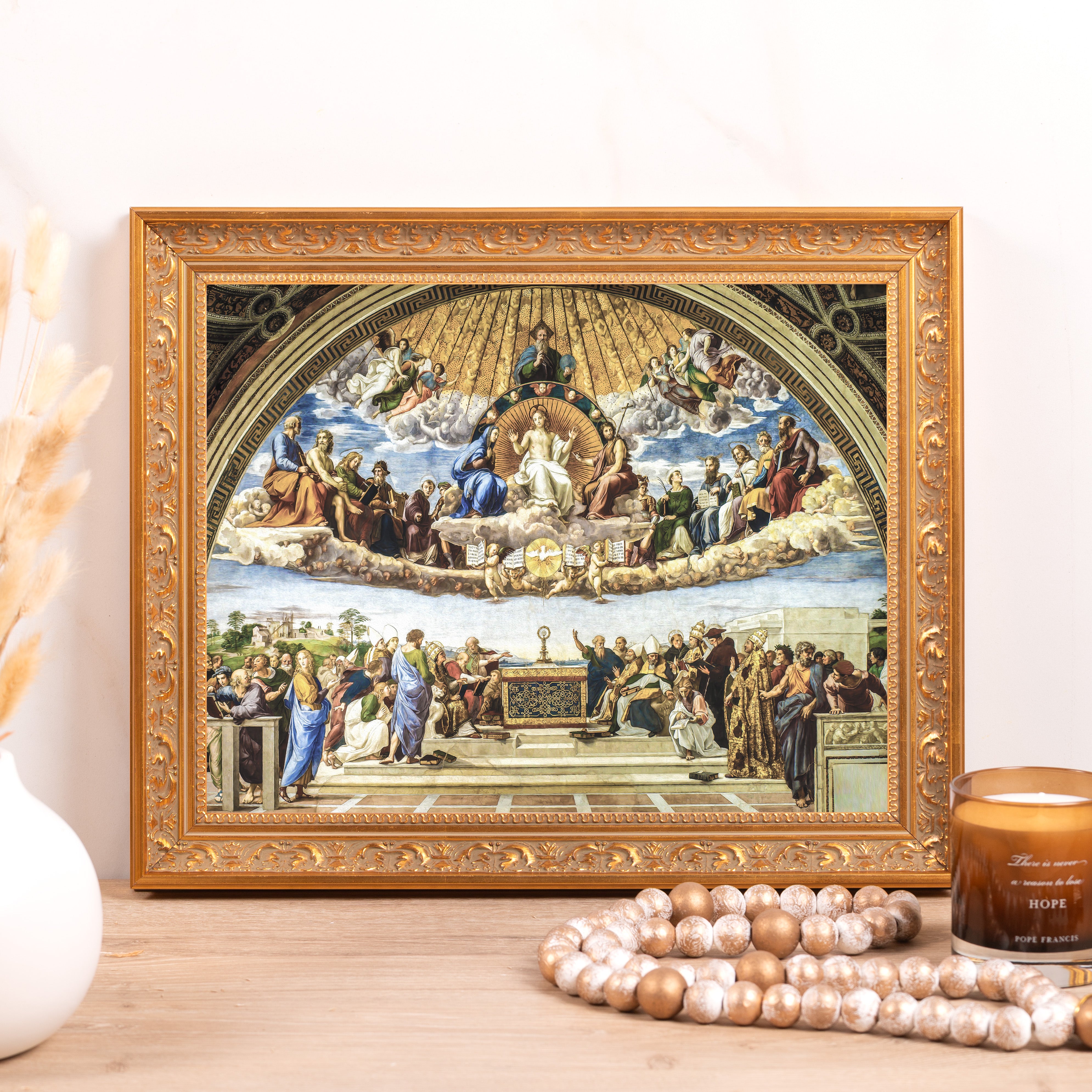 Framed painting of Raphael's Disputation of the Holy Sacrament; a vintage gold frame surrounds the Renaissance-style art print.