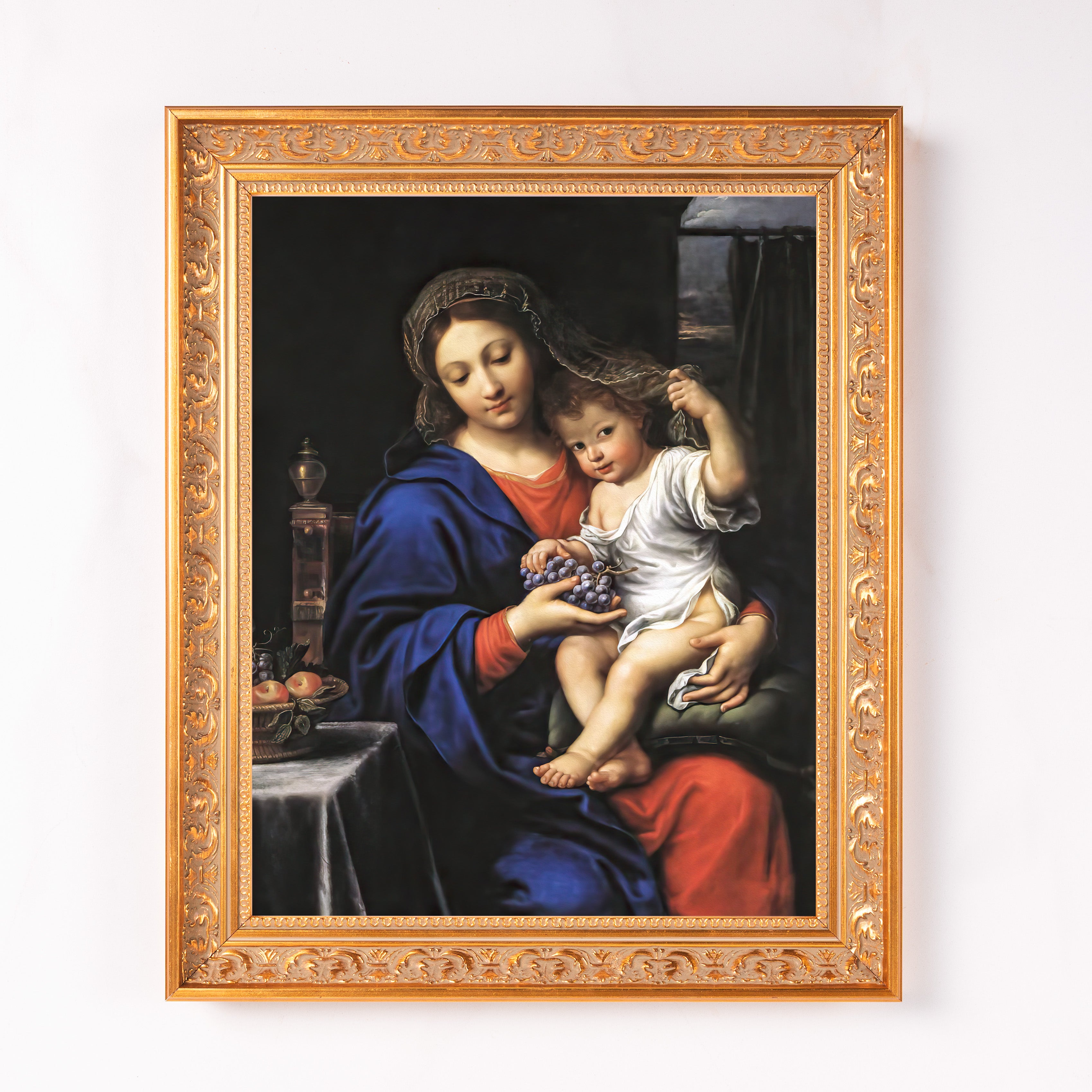 Framed, colorful painting of Mary and baby Jesus; gold frame.