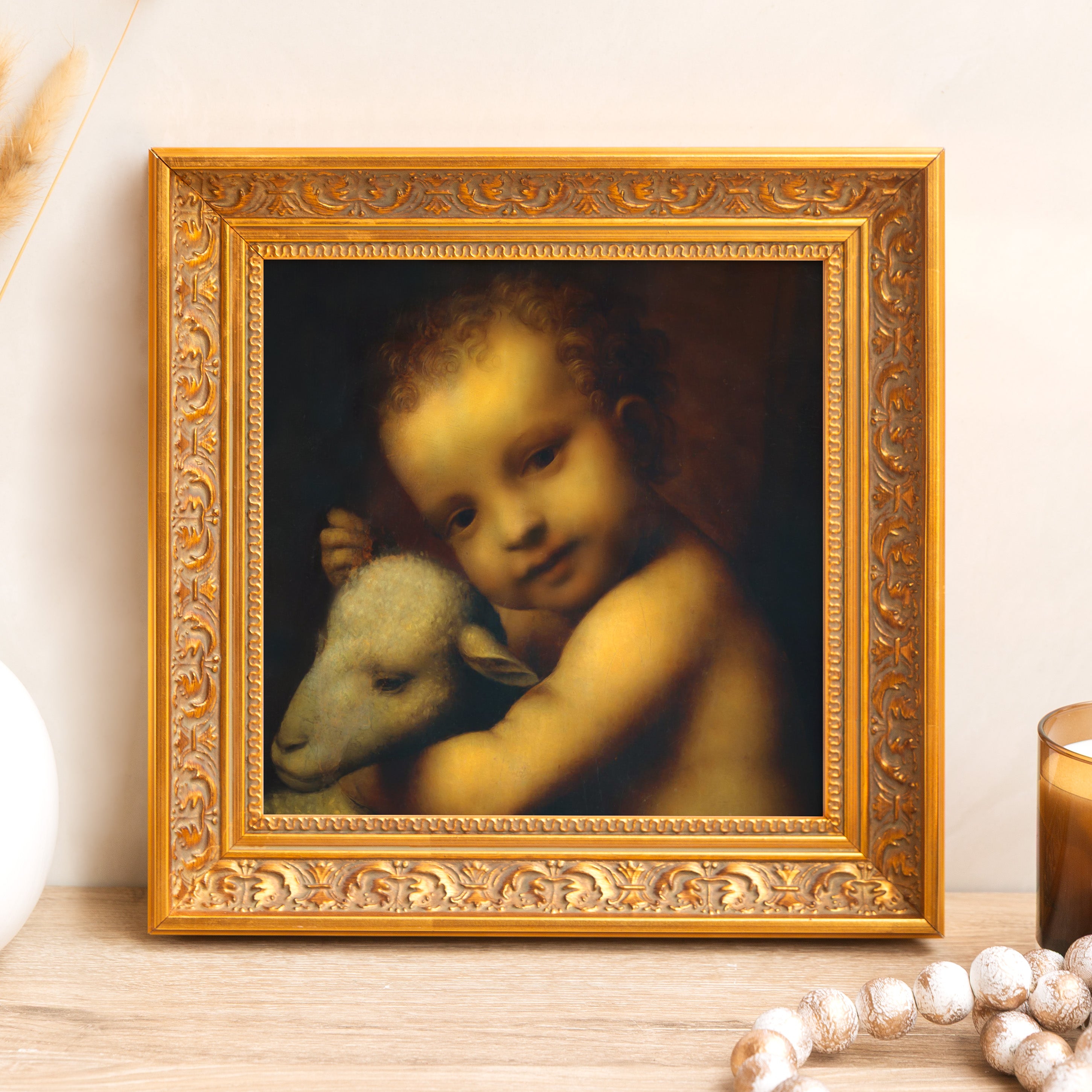 Framed print of baby Jesus with lamb in gold ornate frame, Renaissance style art for home decor.