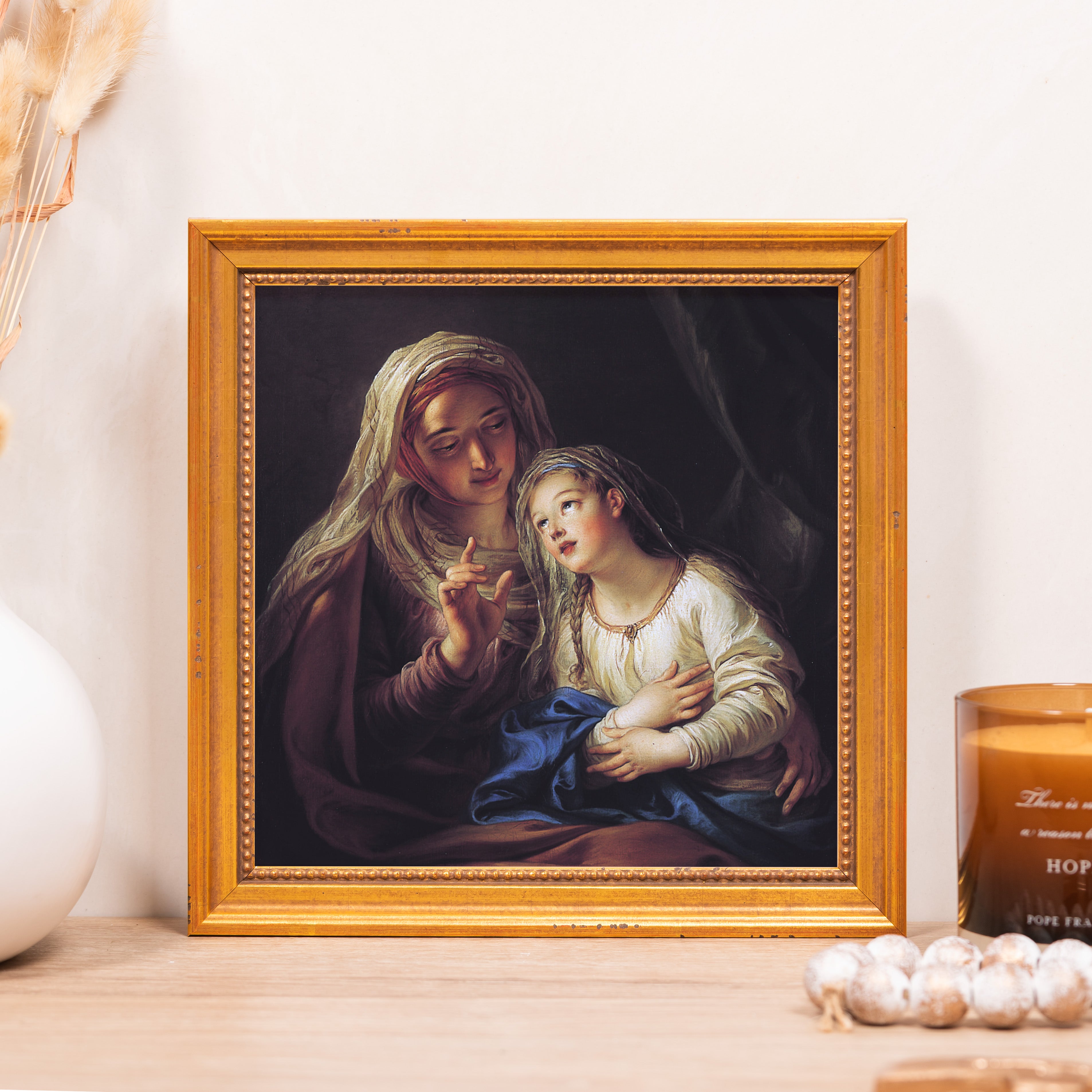 Framed painting depicts a mother and daughter with a gold frame, in a classical style.