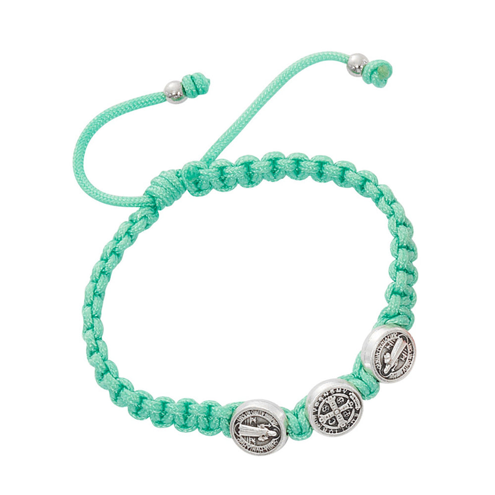 Braided, mint-green bracelet with adjustable closure and three silver Saint Benedict medal charms.