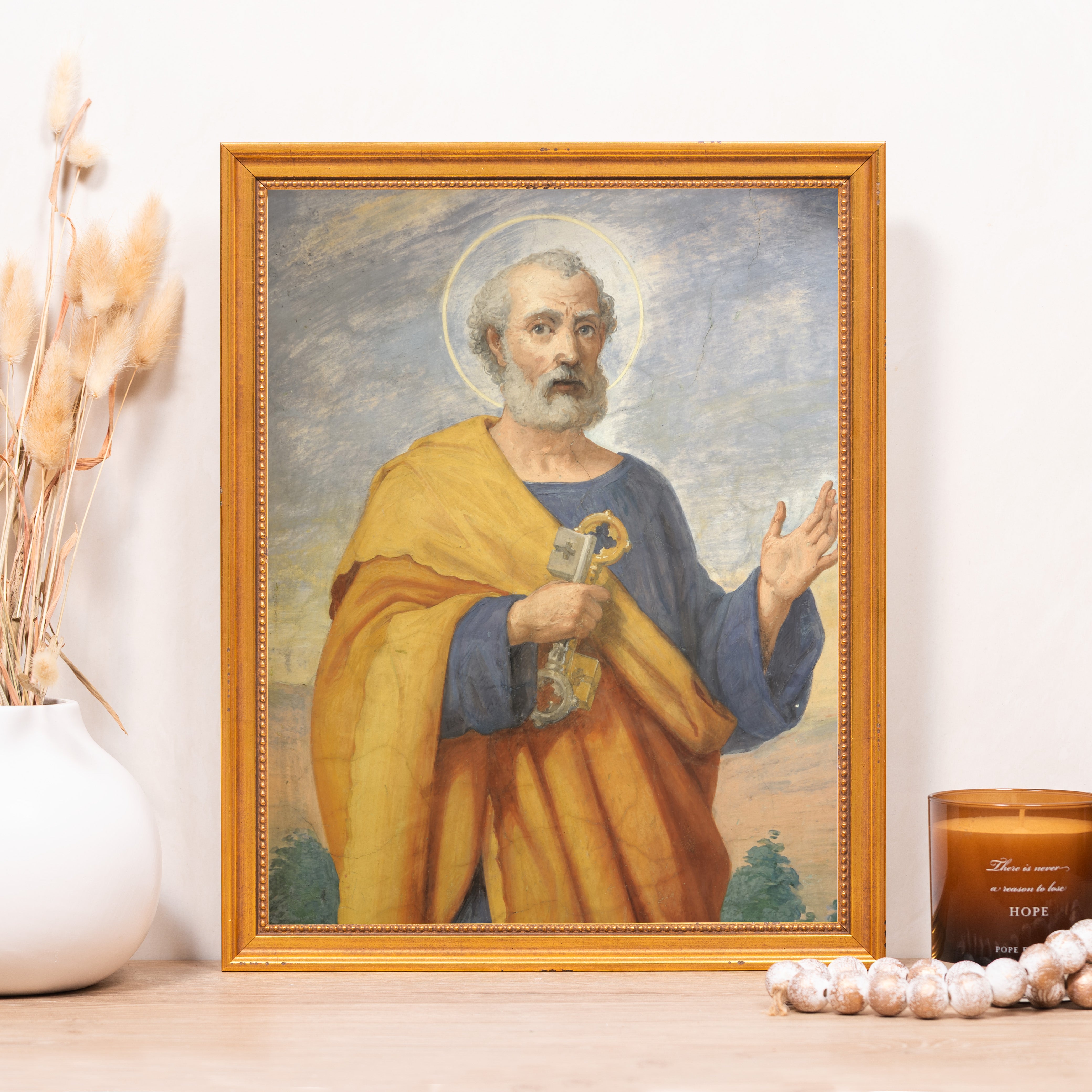 Framed Artwork depicts Saint Peter holding a key, wearing a yellow robe and blue tunic with a golden halo.