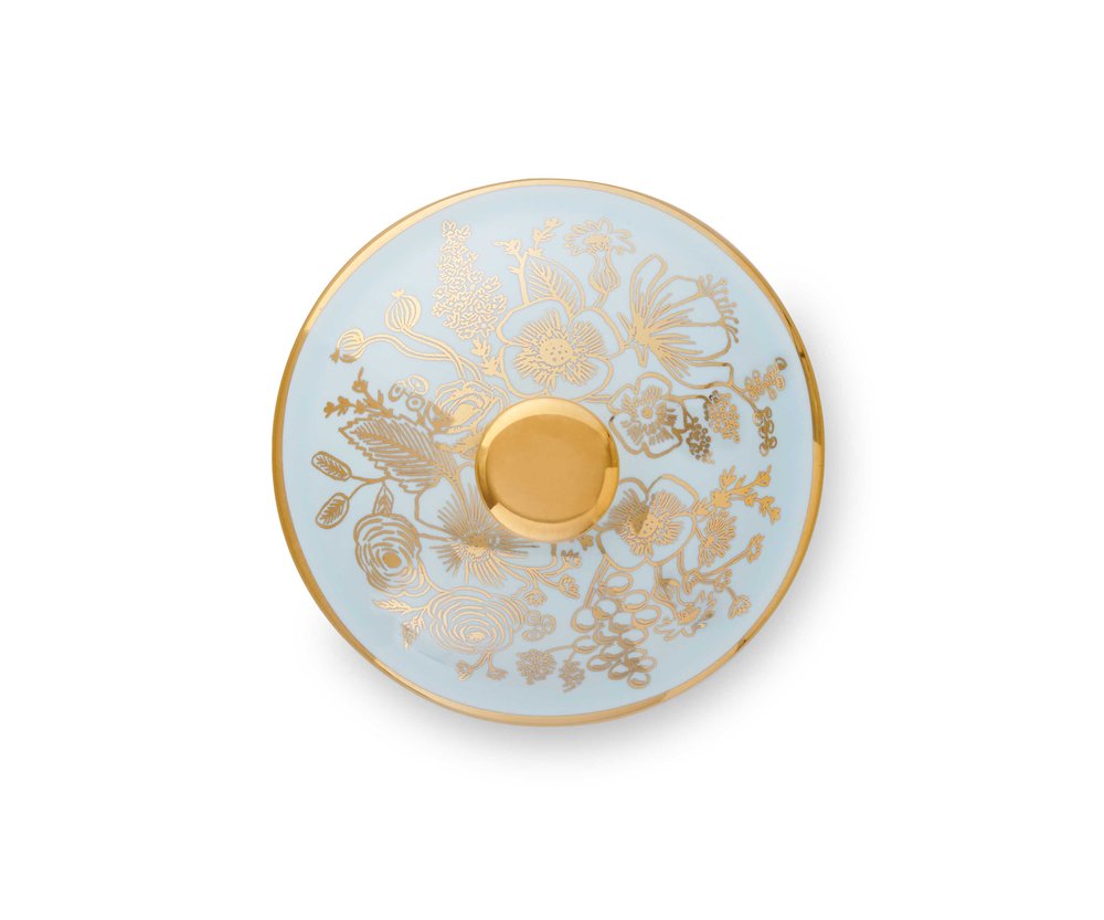 Light-blue ceramic trinket box with gold floral design and gold knob on top.
