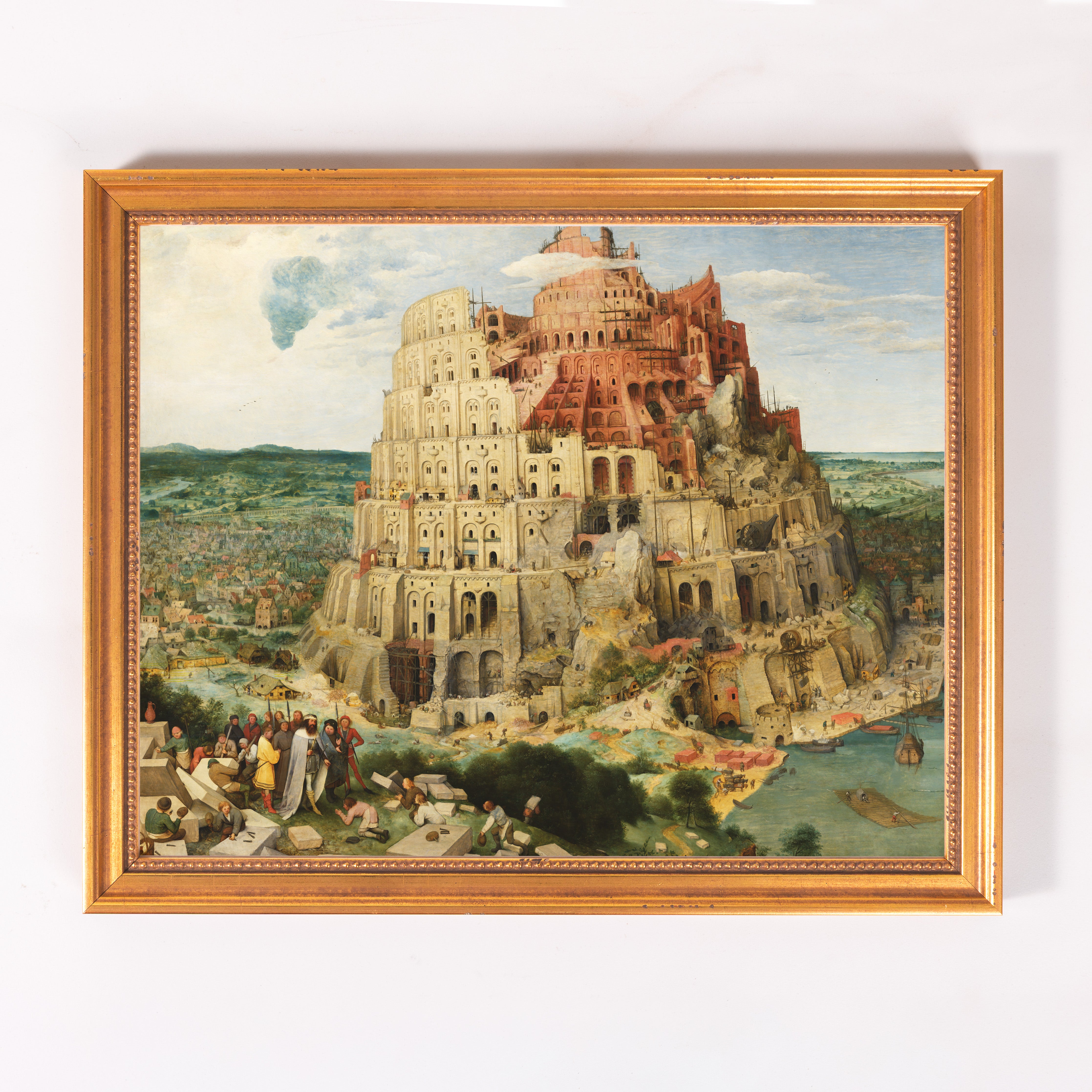 Framed Painting of the Tower of Babel, rendered in oil paint with a gold frame, depicting the biblical tower.