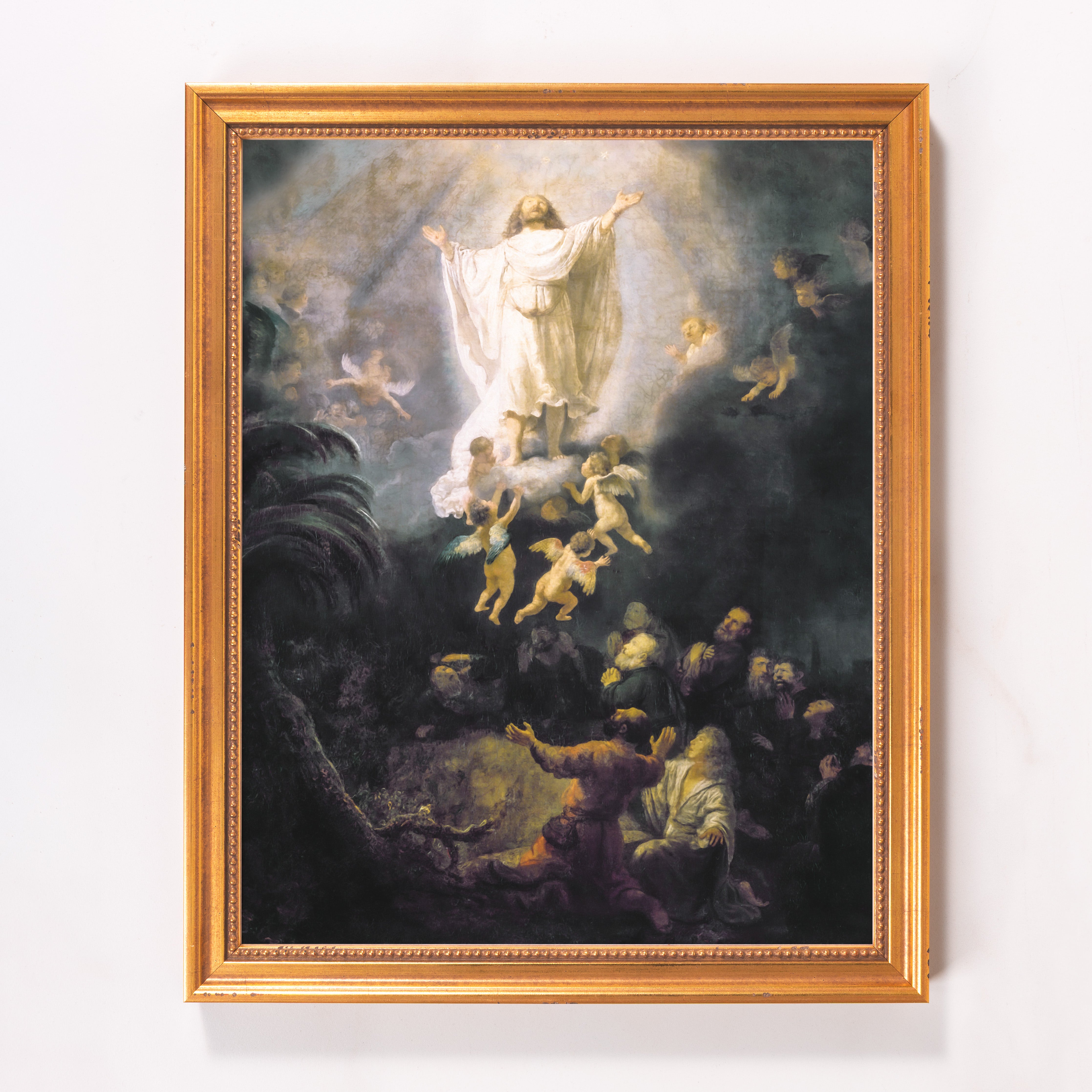 Framed painting of the ascension of Jesus with a gold frame and old master style with angels.
