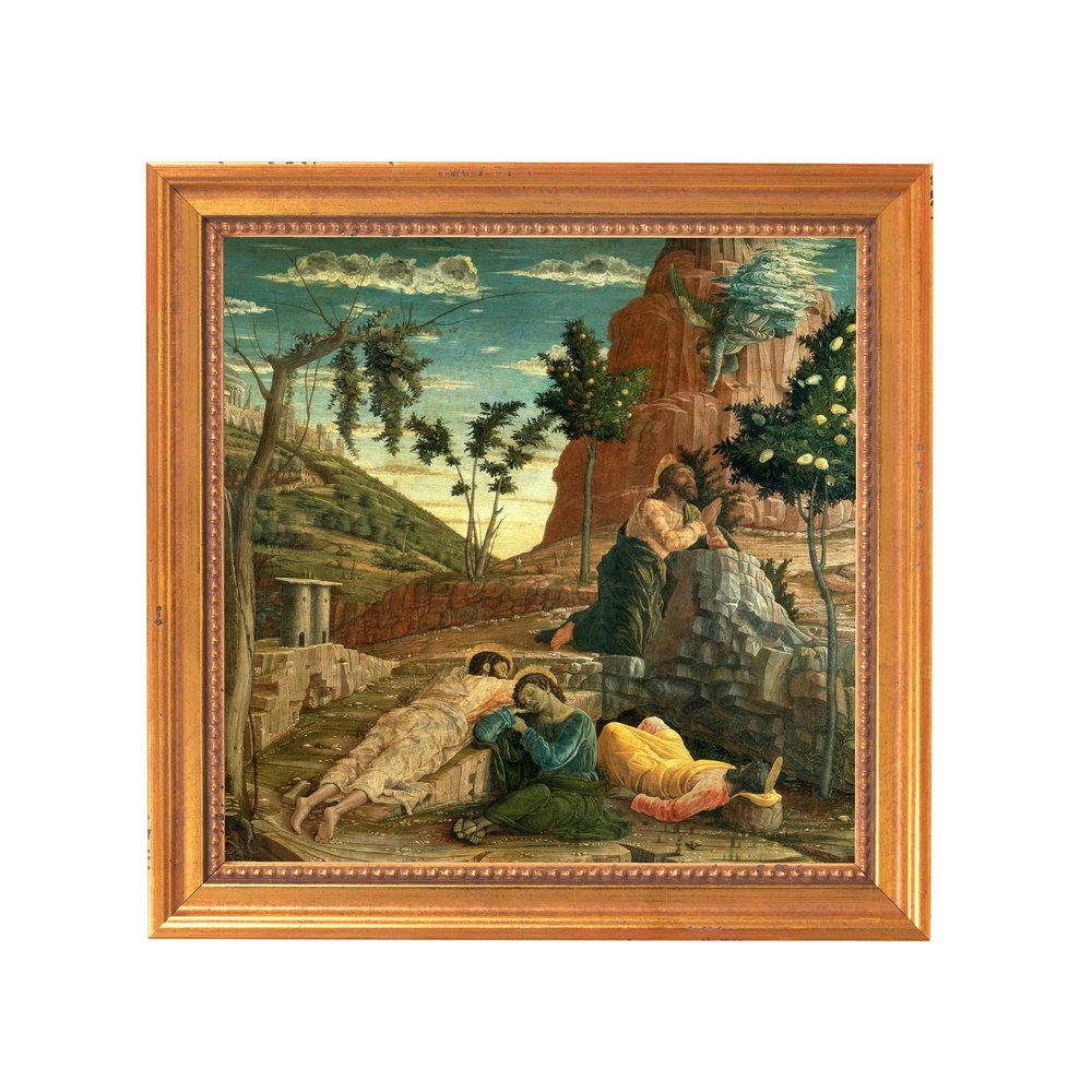 Framed painting depicts biblical scene of Jesus praying in Gethsemane, with sleeping disciples, on a rocky landscape, framed in gold wood tone frame.