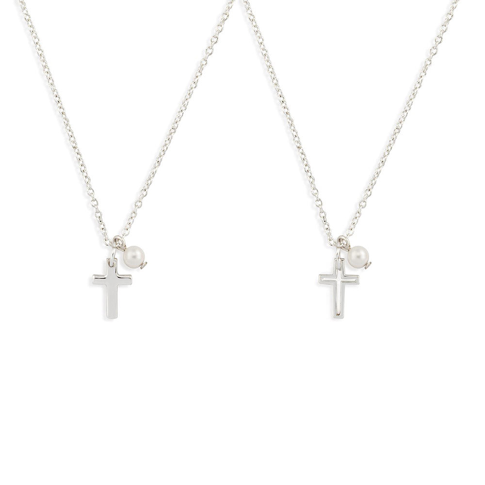 Two silver chain necklaces with cross pendants and pearls for religious or personal expression.