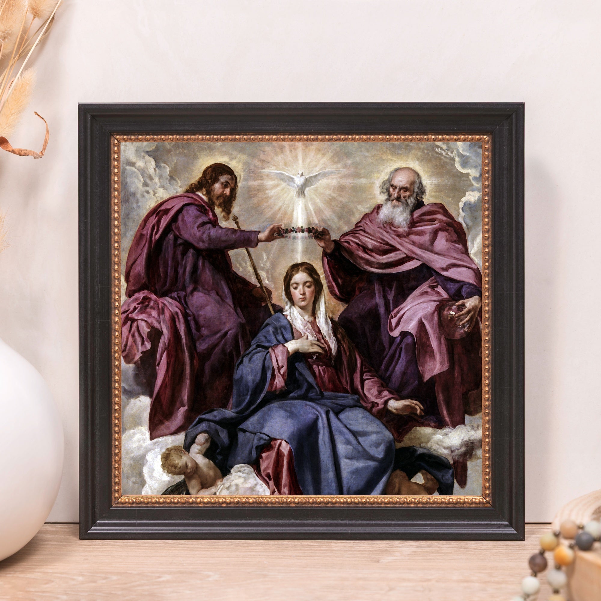 Framed painting "The Coronation of the Virgin" depicts biblical scene in a black frame with gold trim.