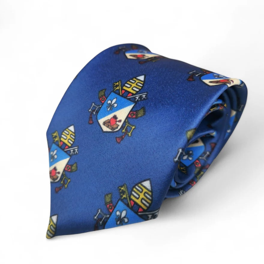 Blue necktie with a repeating coat of arms design.