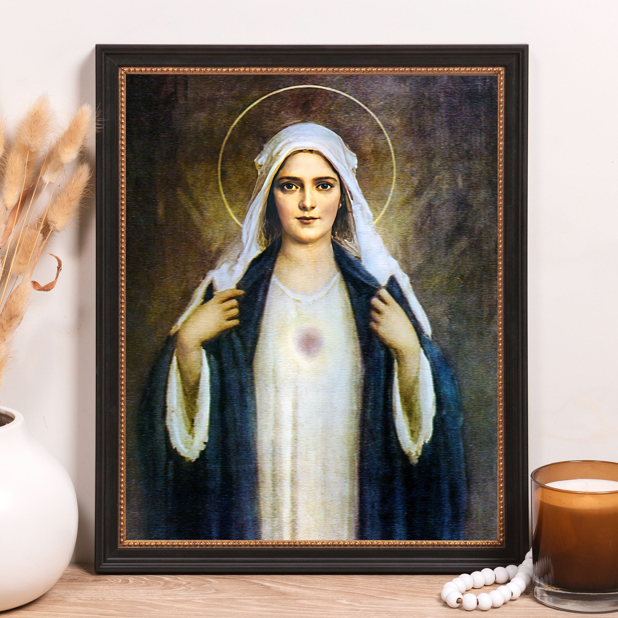 Framed Our Lady of Grace print with white and blue robes, black frame, classic style.