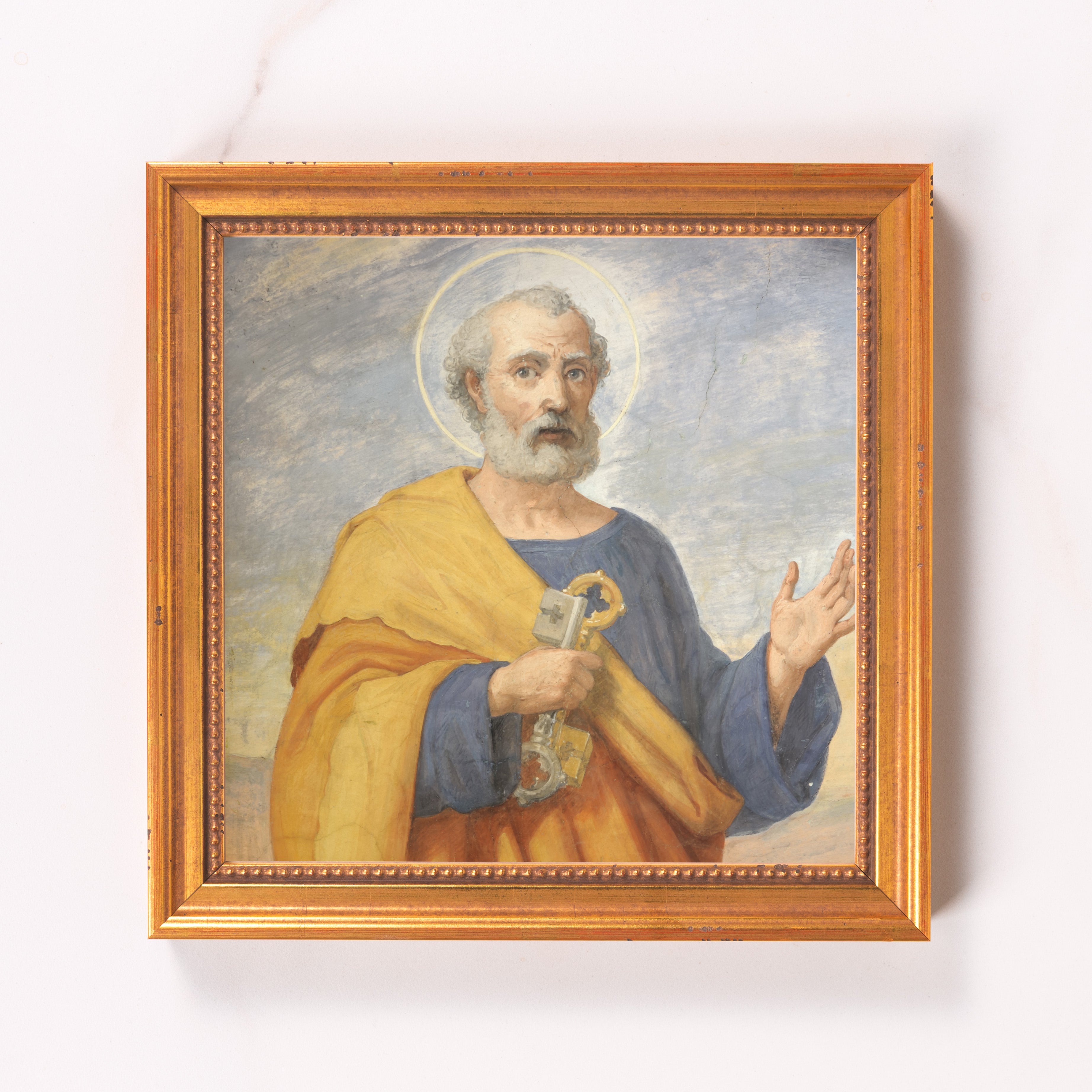 Framed Saint Peter art piece with a golden wood frame, featuring a biblical painting of St. Peter holding keys.