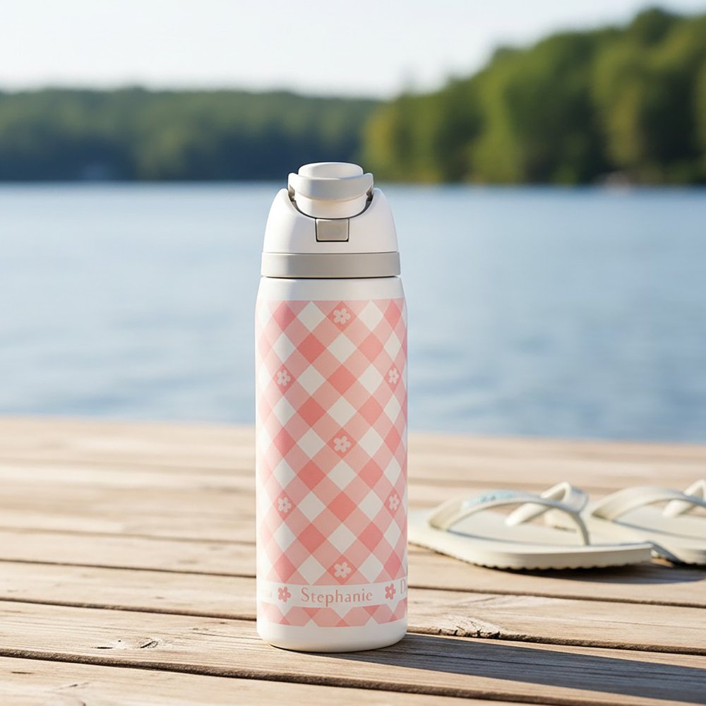 Personalized water bottle with a pink gingham pattern and the name "Stephanie" on it.