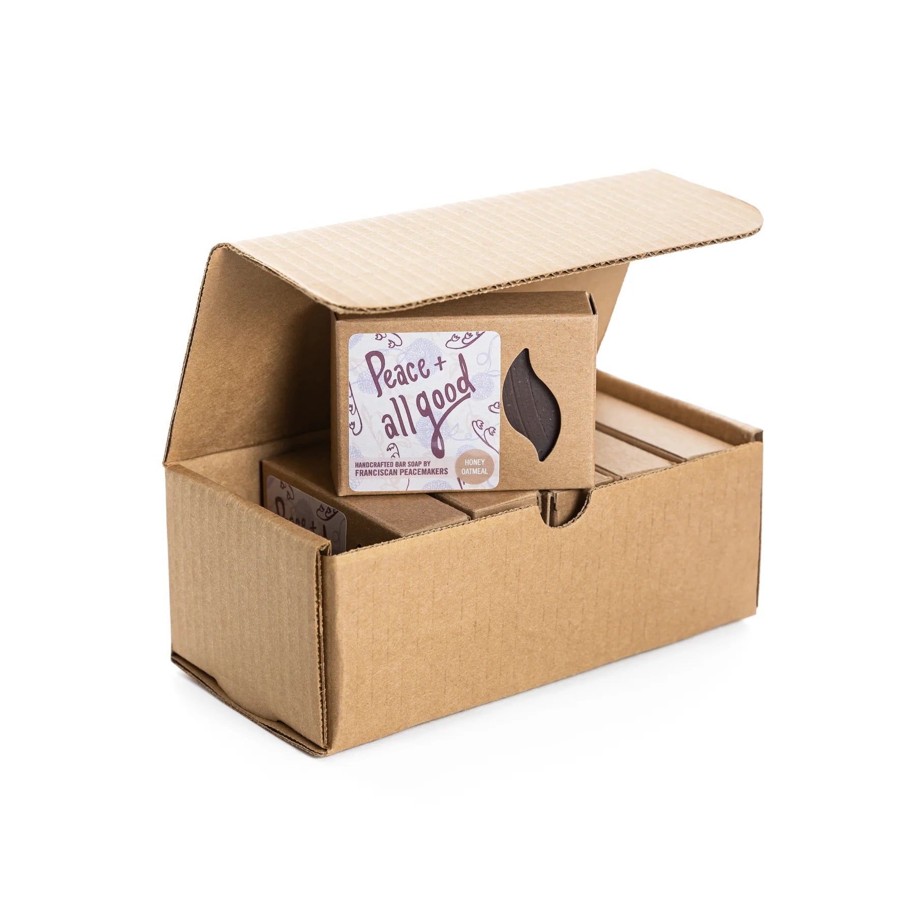 Honey Oatmeal bar soap in open brown cardboard box with label.