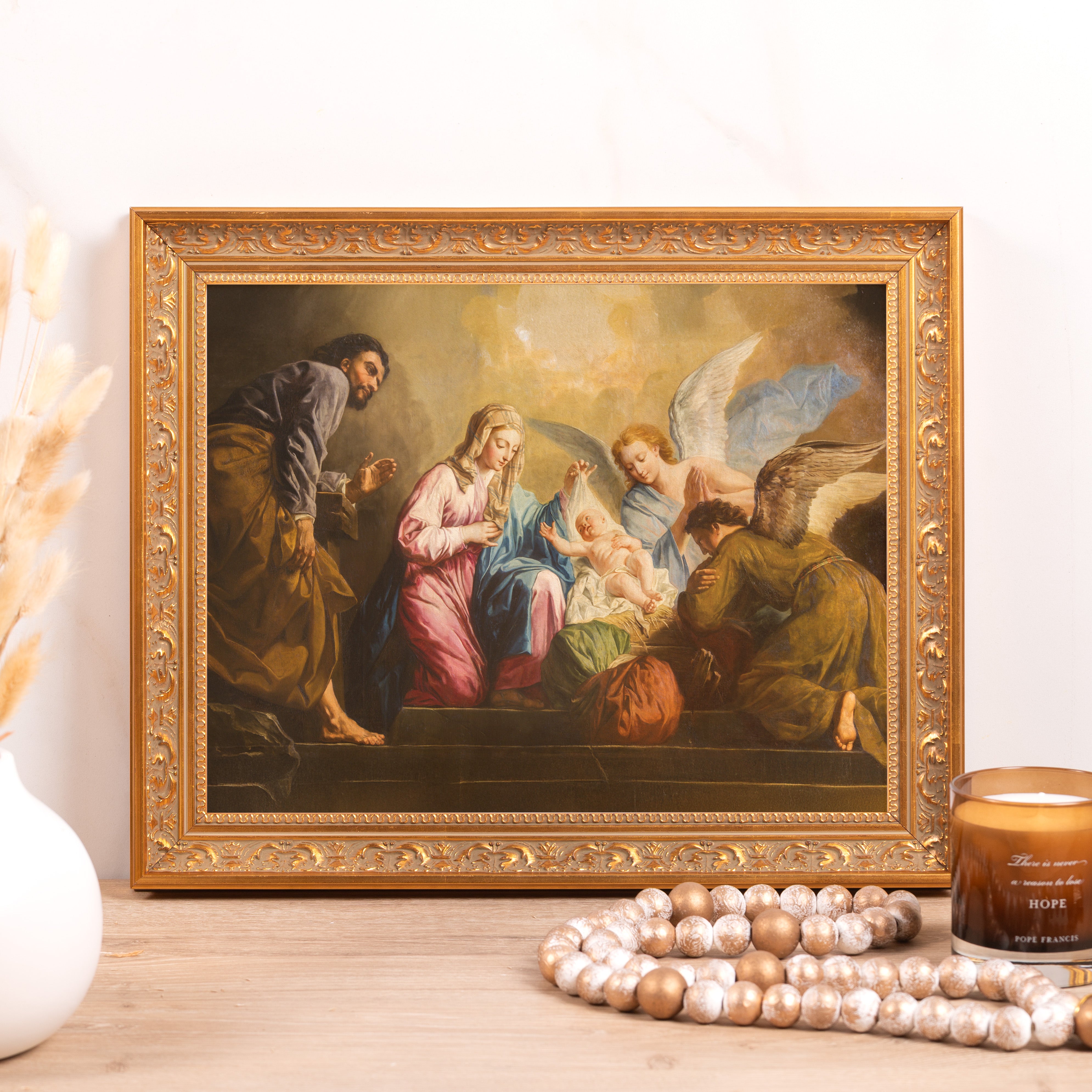 Framed "Adoration of the Shepherds" art print; a religious painting in an ornate gold frame.