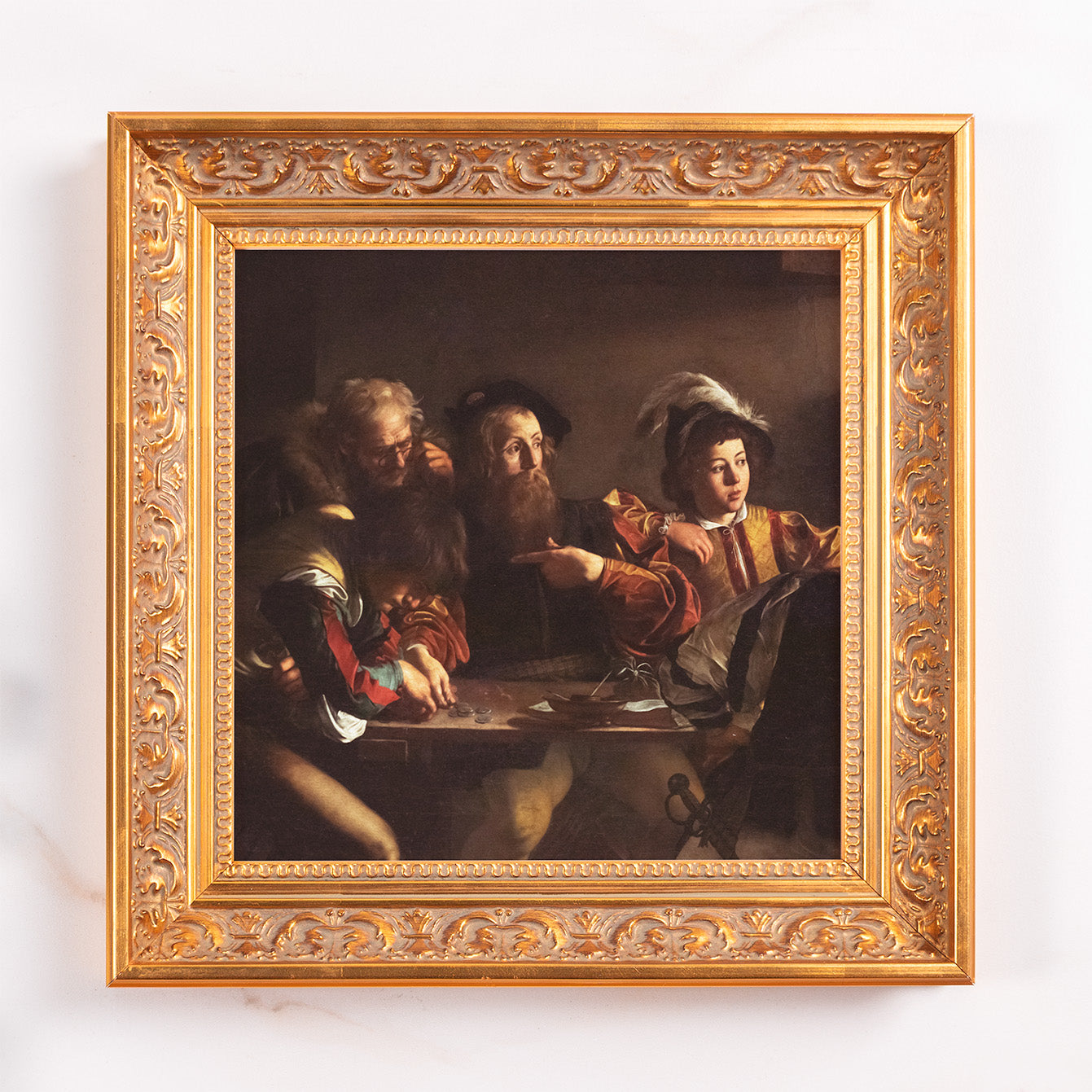 Framed antique reproduction art print of men gambling, in a gold ornamental frame.