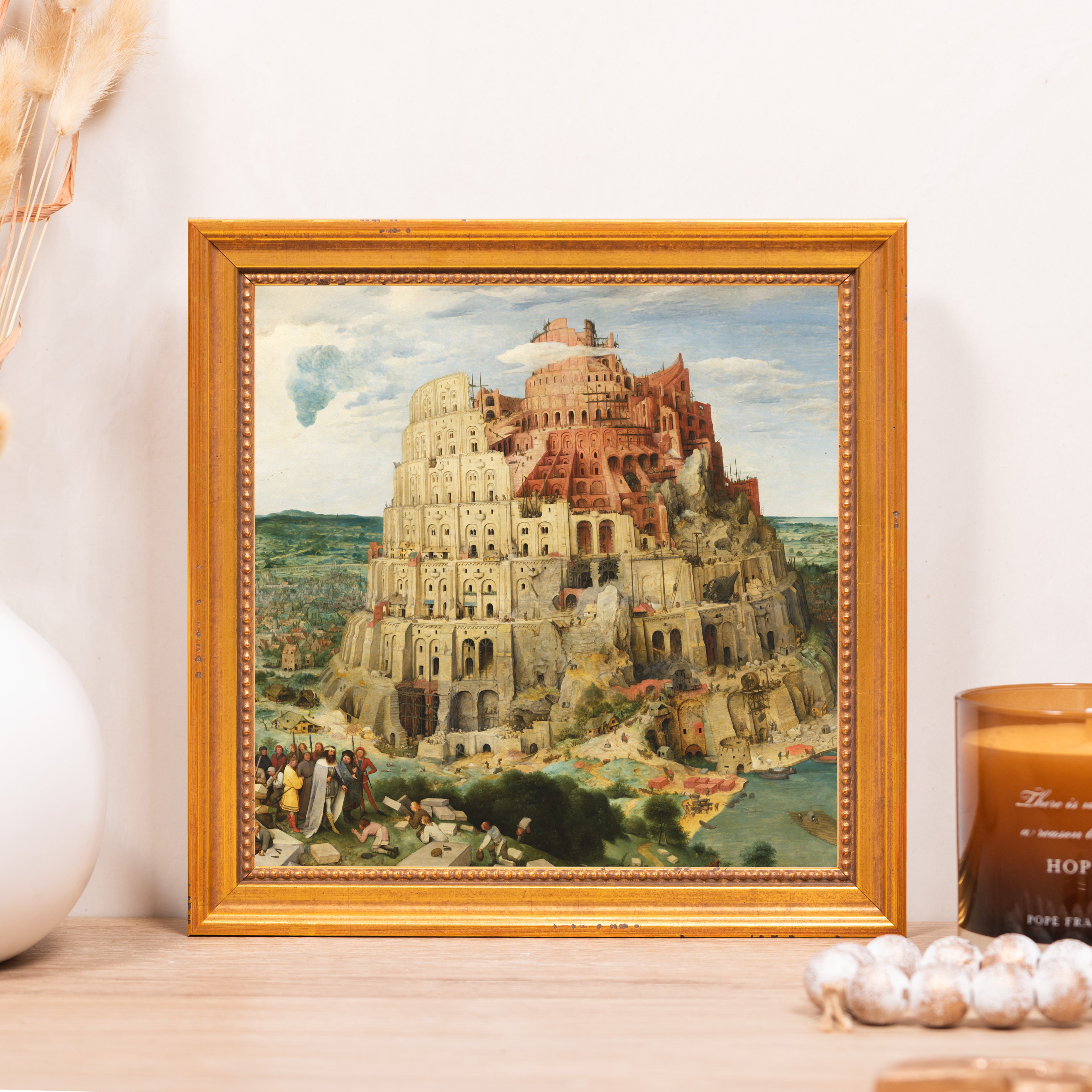 Framed painting of Tower of Babel in gold frame.