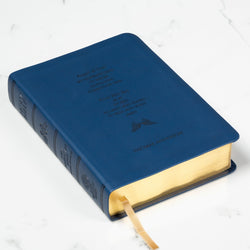 Personalized, navy leatherette Bible with gilded page edges and ribbon bookmark.