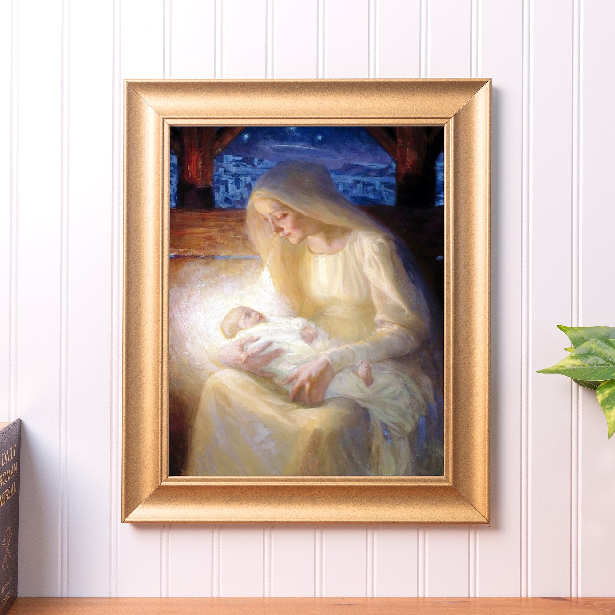 Framed print of Mary and Jesus for religious decor. Gold frame and soft colors.
