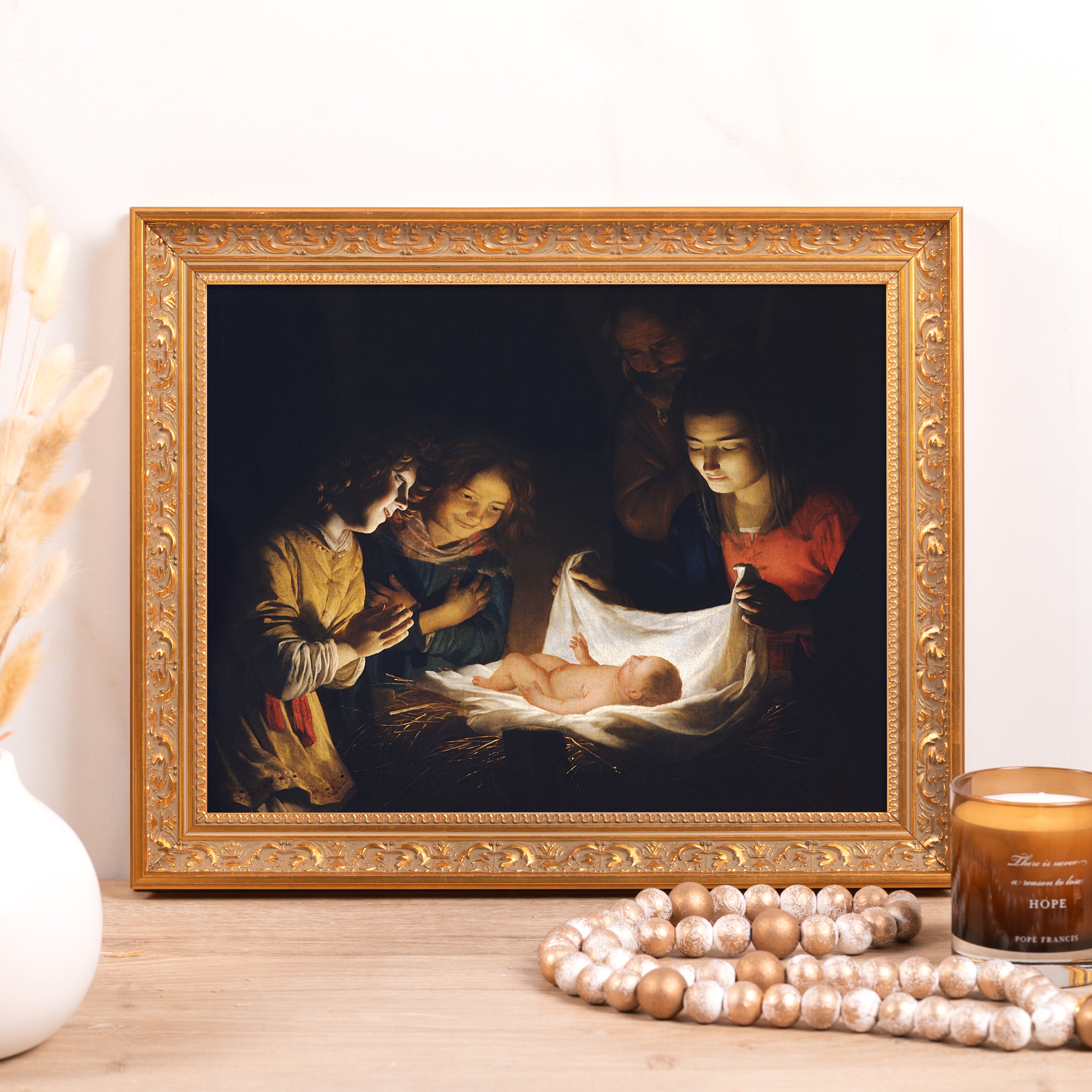 Framed Nativity painting with gold frame.