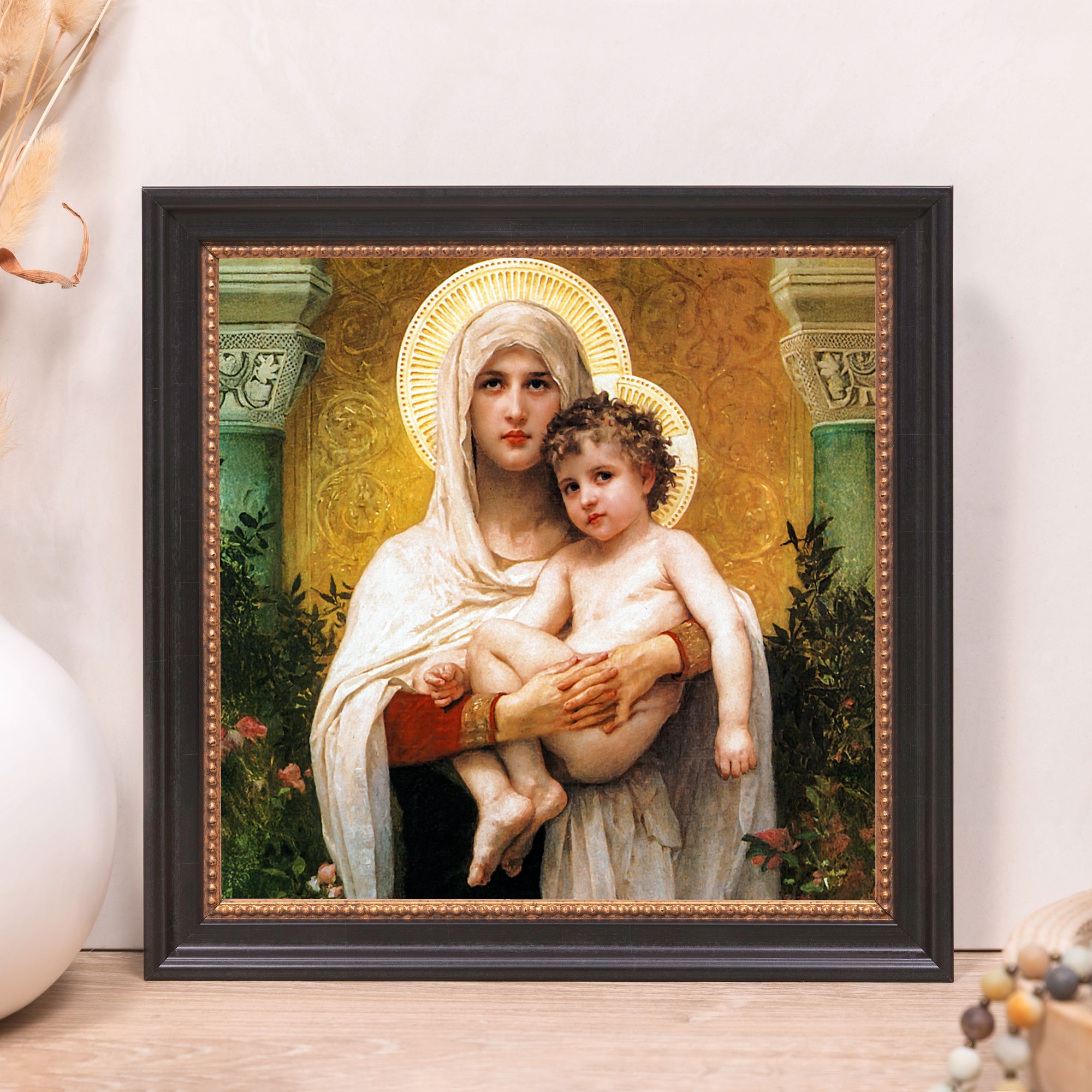 Framed print depicts Mary and Jesus with halos, in classic style and black frame.