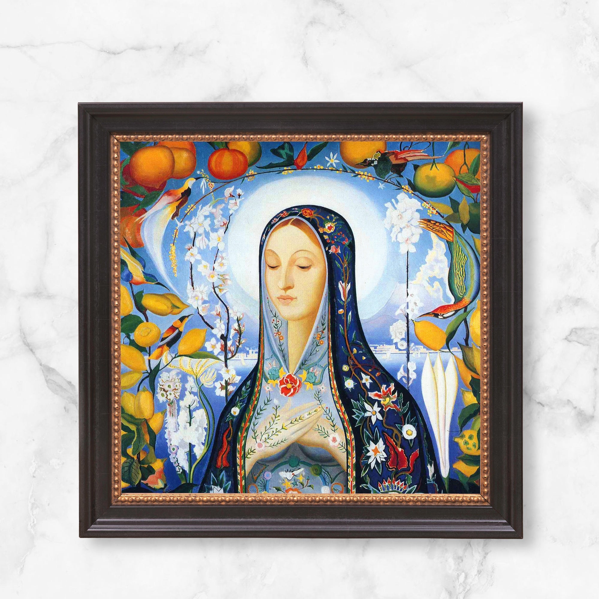 Framed wall art. Art nouveau style, colorful floral painting of a woman with a halo on a sky-blue background.
