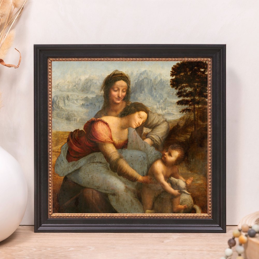 Framed "The Virgin and Child with Saint Anne" print. Black frame with Renaissance style art.