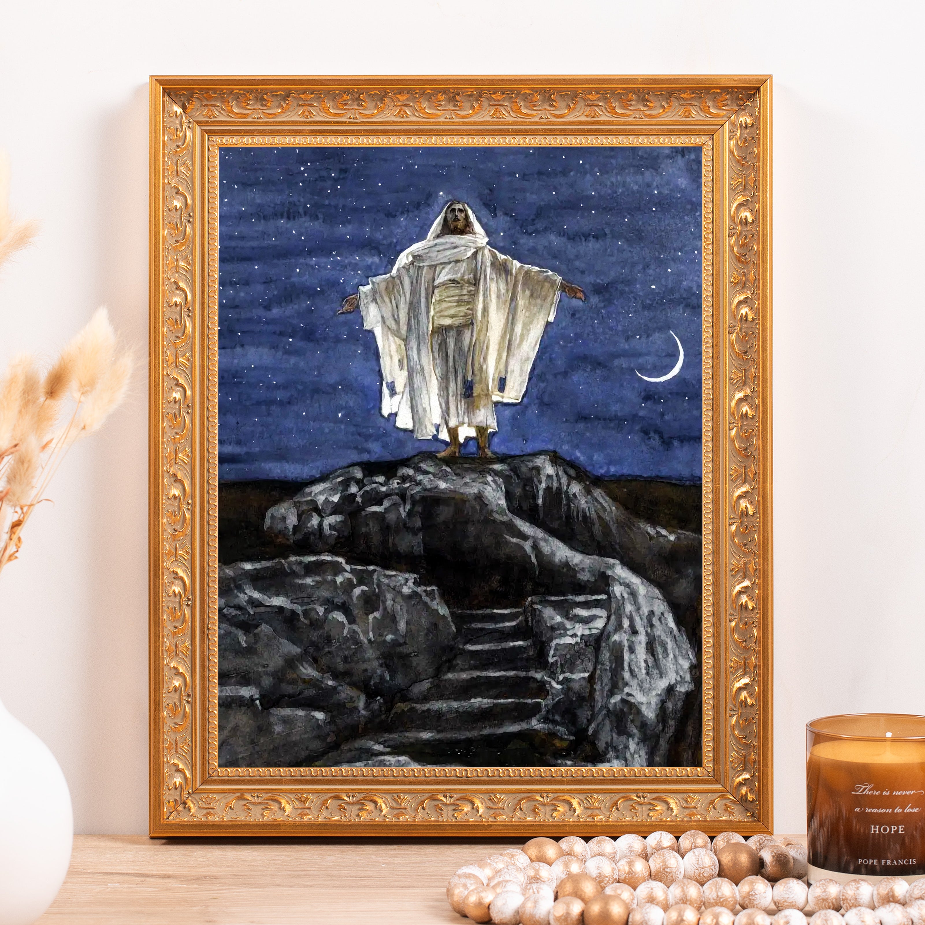 Framed print of Jesus in a white robe standing atop a rock at night, with a starry blue sky and crescent moon.