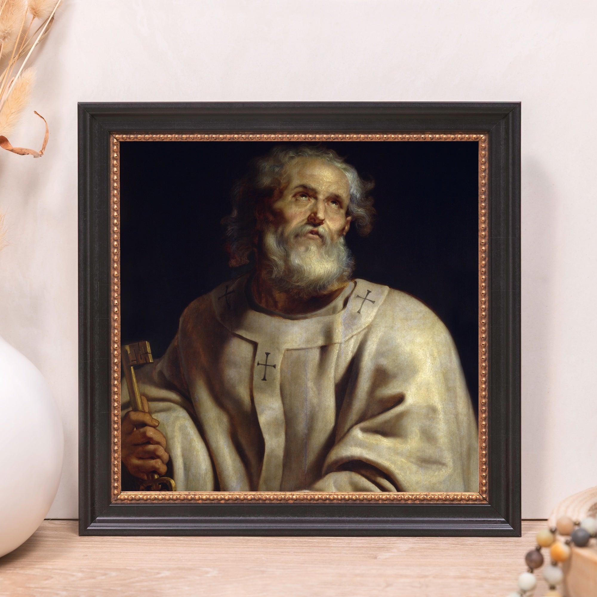 Framed art print of St. Peter holding a key, in a dark wood frame with gold bead detail.