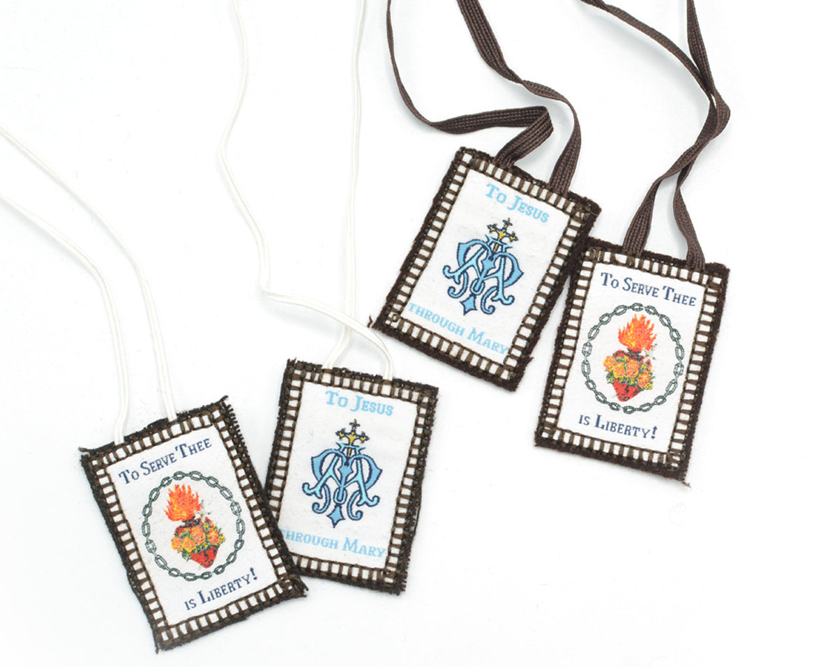 Religious scapulars with brown trim and strings, featuring Christian imagery and text.