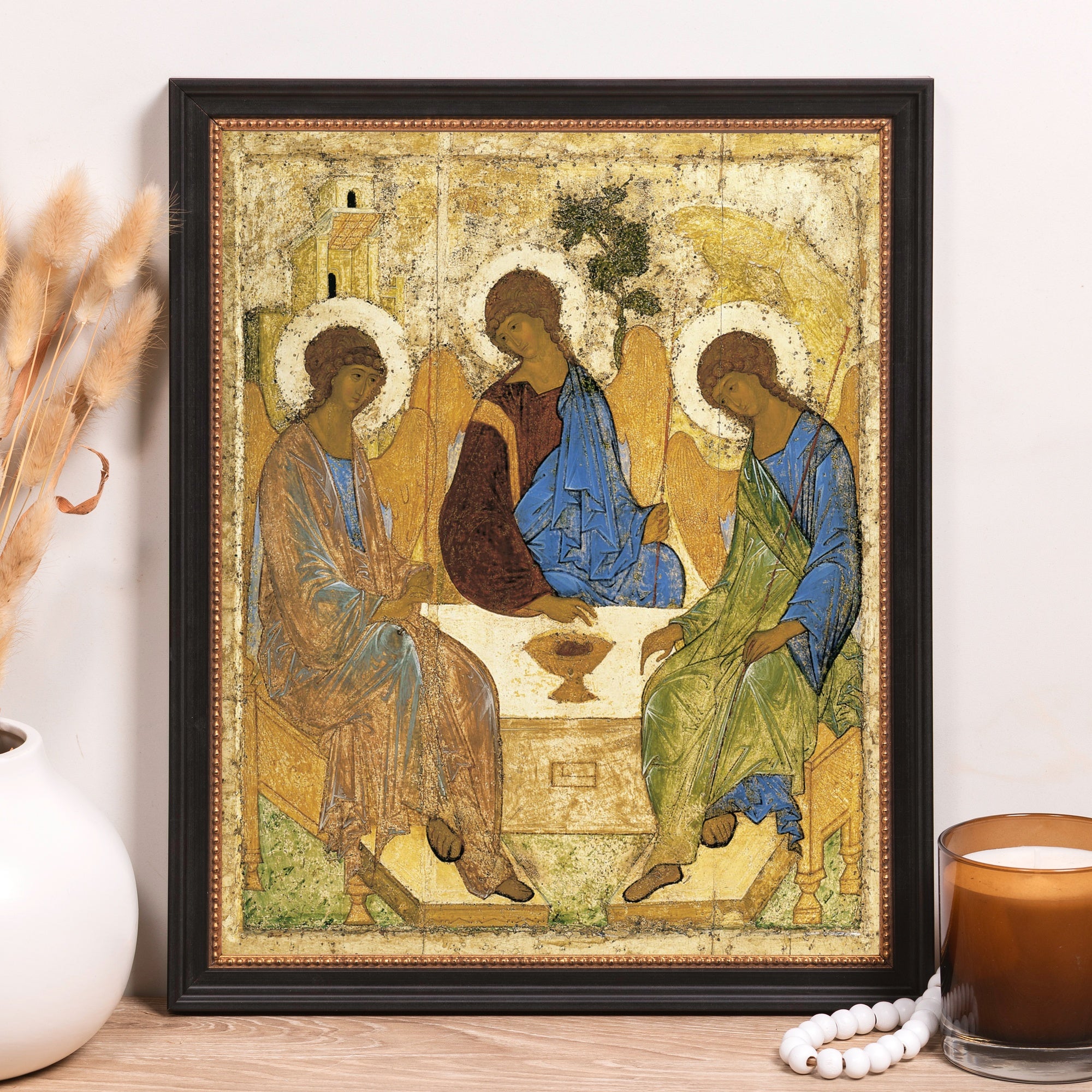Framed "Trinity" Icon depicting three haloed figures; painted wood, gold, blues, green, and brown tones in a classic style.