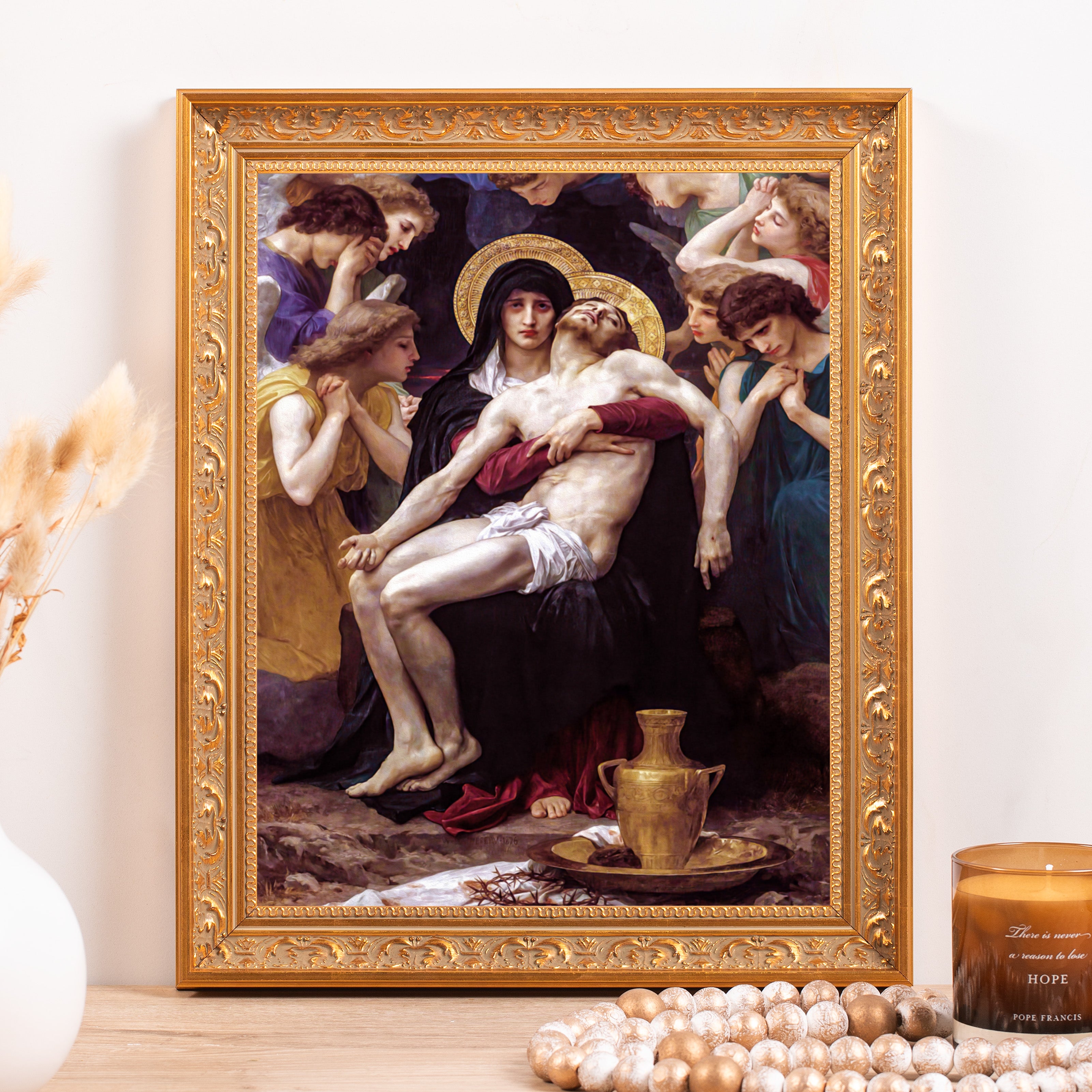 Framed "Pieta" print features ornate gold frame, oil paint style artwork with religious figures and dark colors.