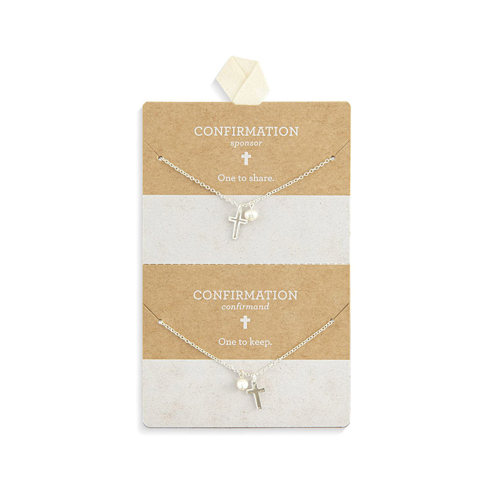 Silver cross necklaces with pearl accents on a kraft card, "One to Share" and "One to Keep" for Confirmation gifts.
