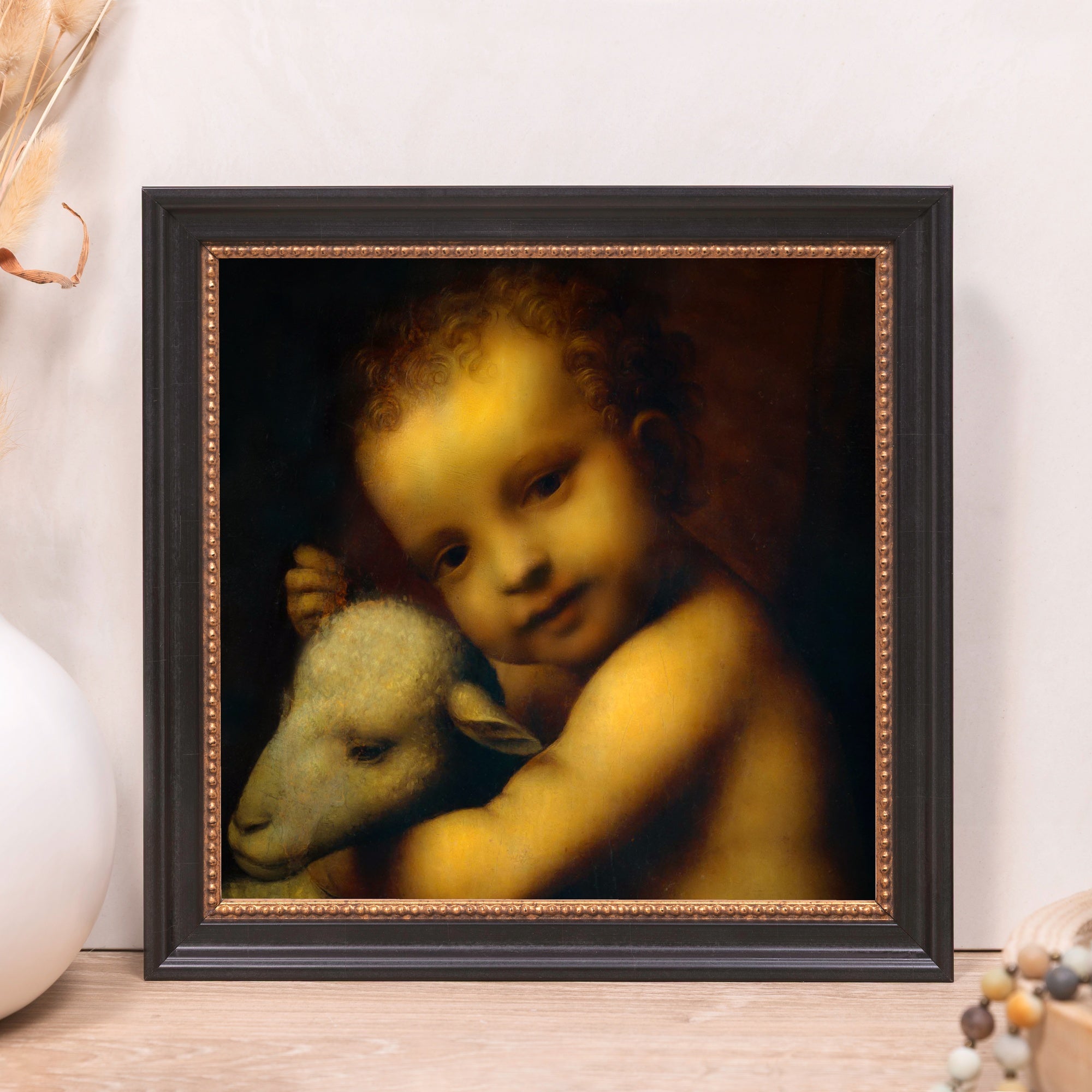Framed print of Jesus and lamb, dark wood and gold tone frame, classic style.