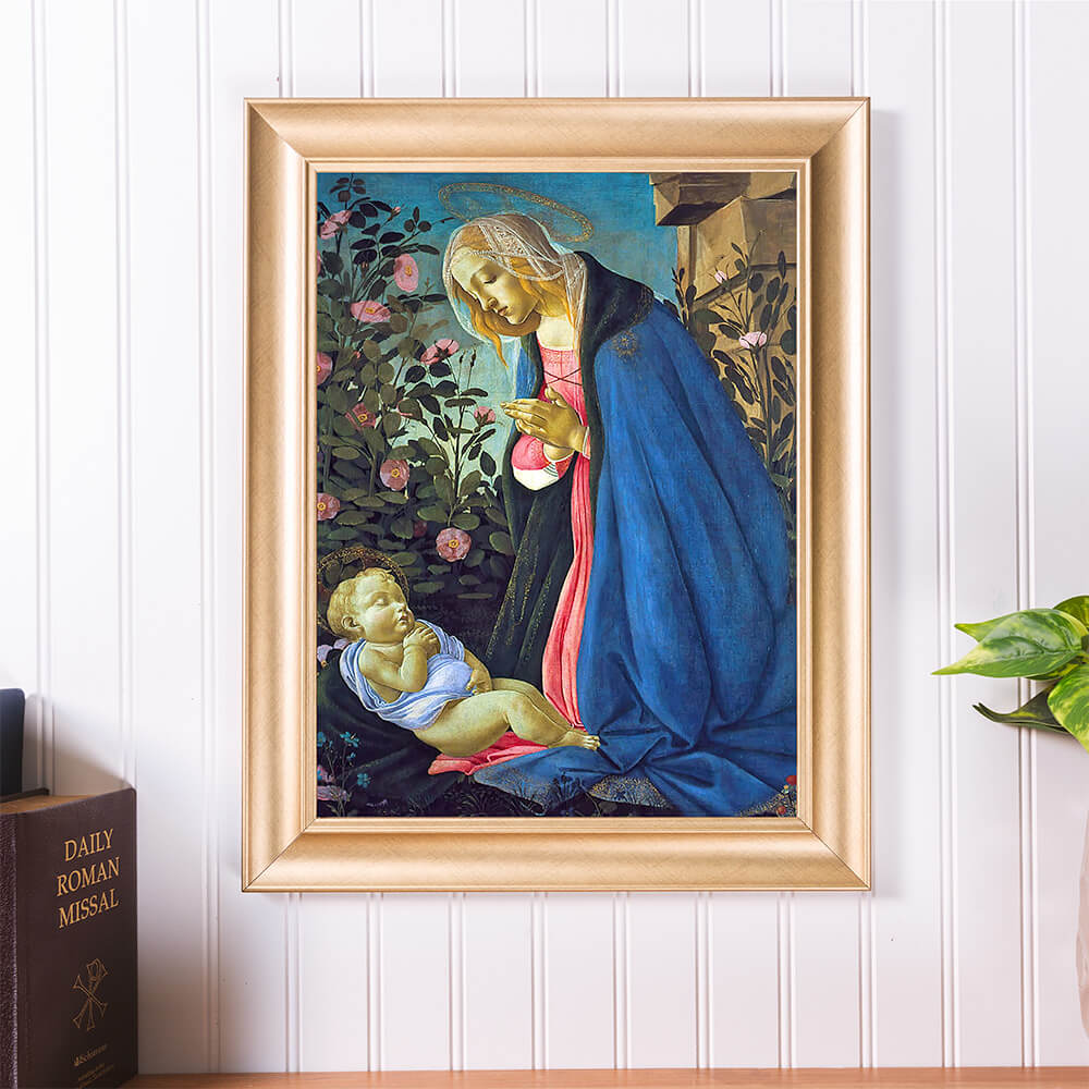Framed painting print depicts Madonna and Child in the rose garden, with blue robes and gold frame.