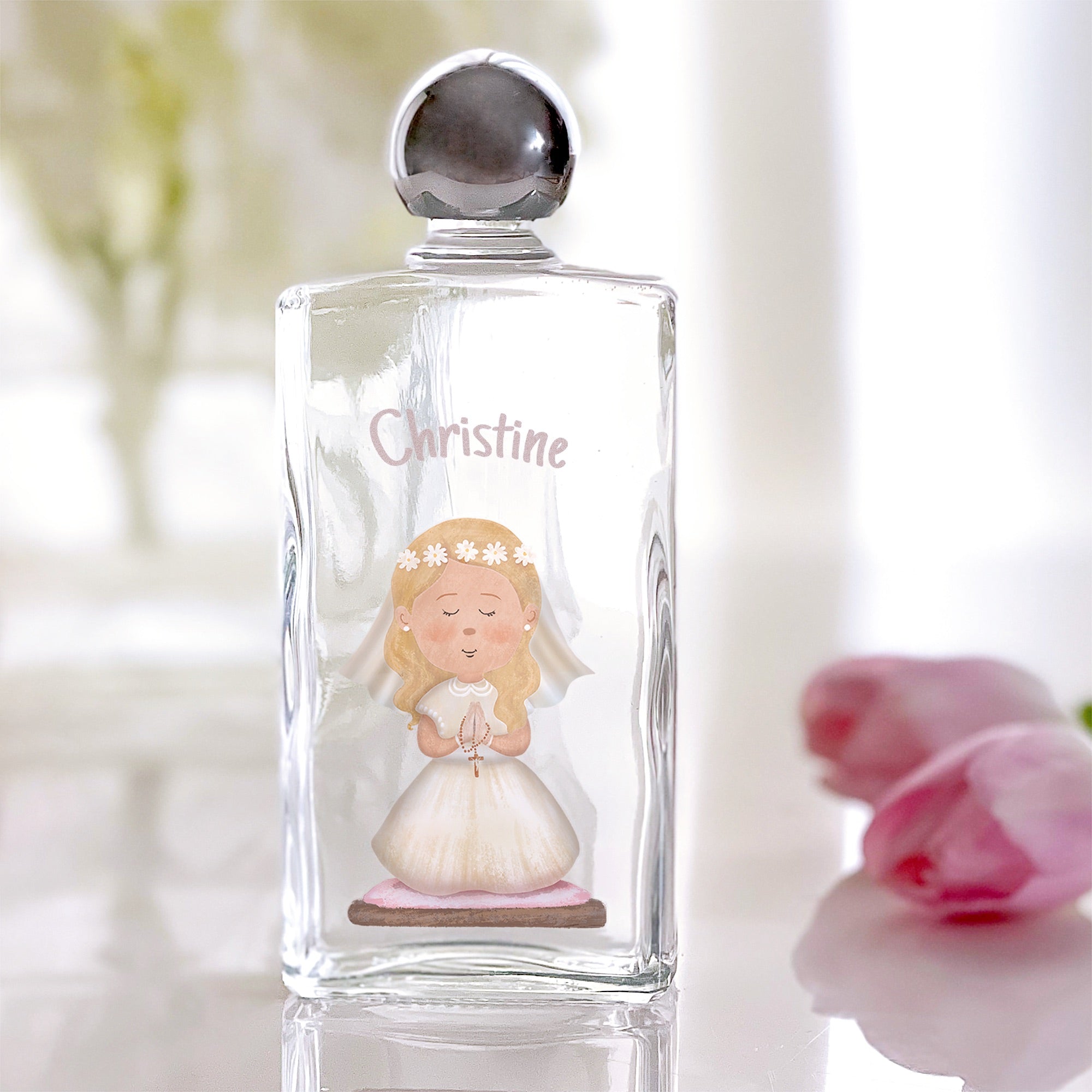 Holy Water bottle with girl illustration and "Christine" on clear glass with silver cap.