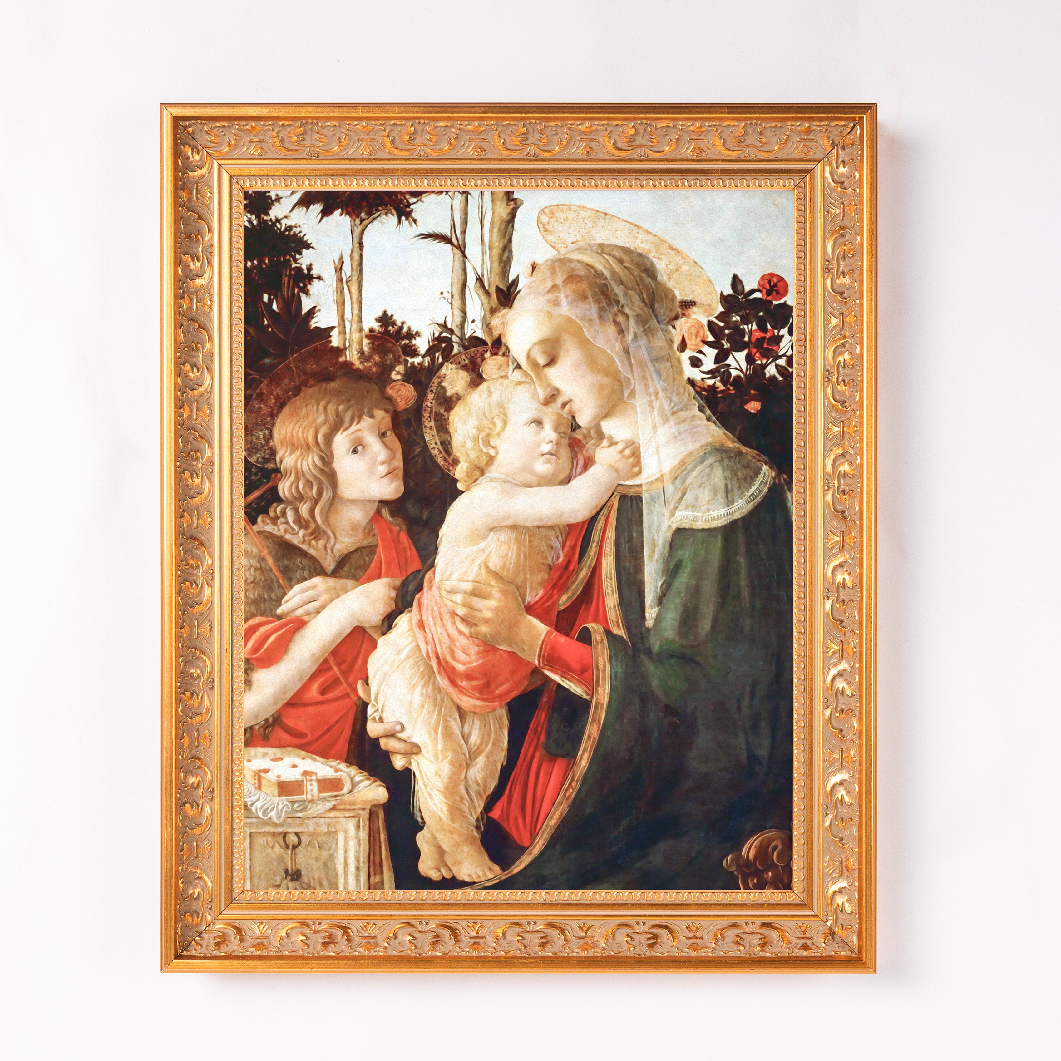 Framed Renaissance painting of Mary and baby Jesus in a gold ornate frame.