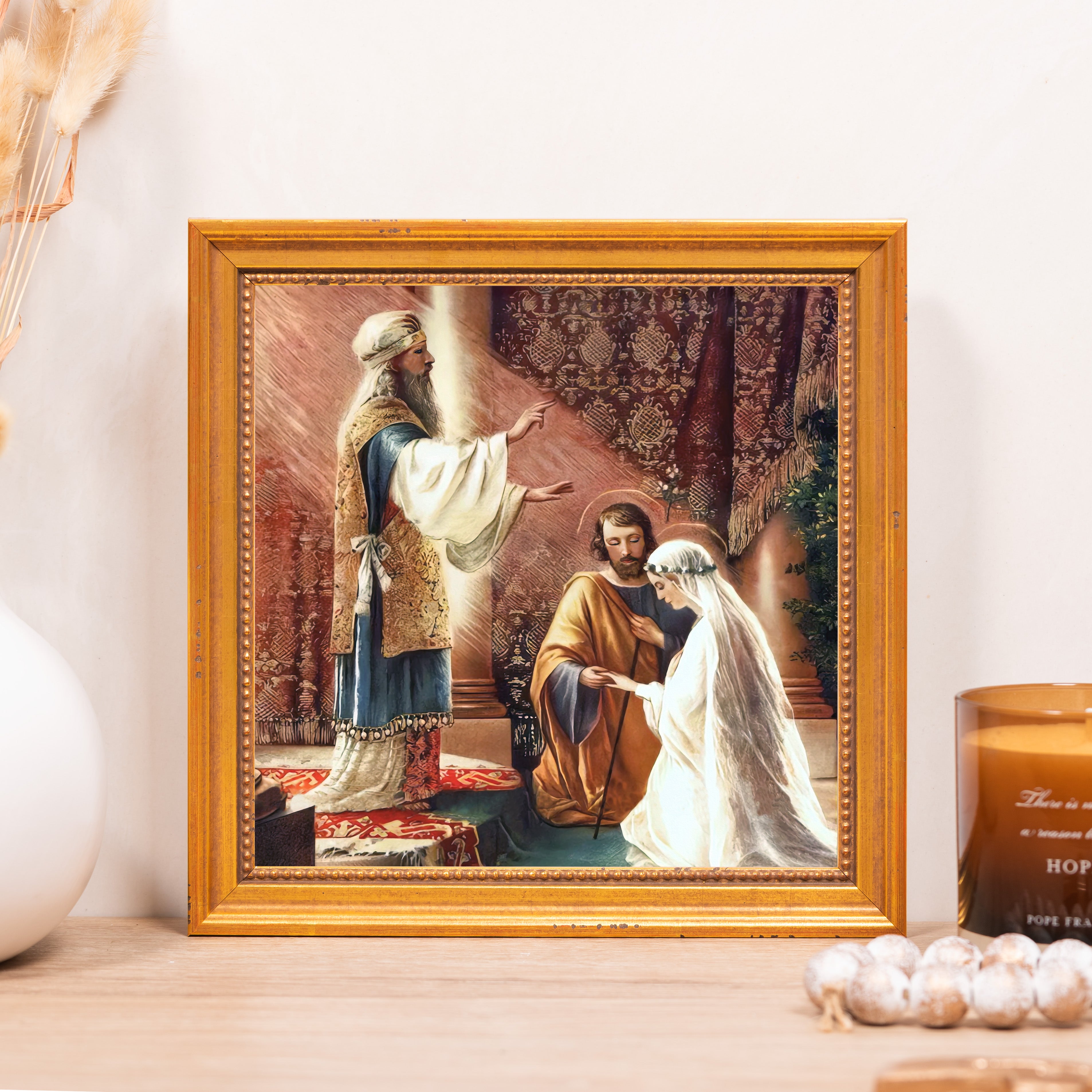 Framed Art depicts a religious scene of Mary and Joseph's marriage in a gold frame.