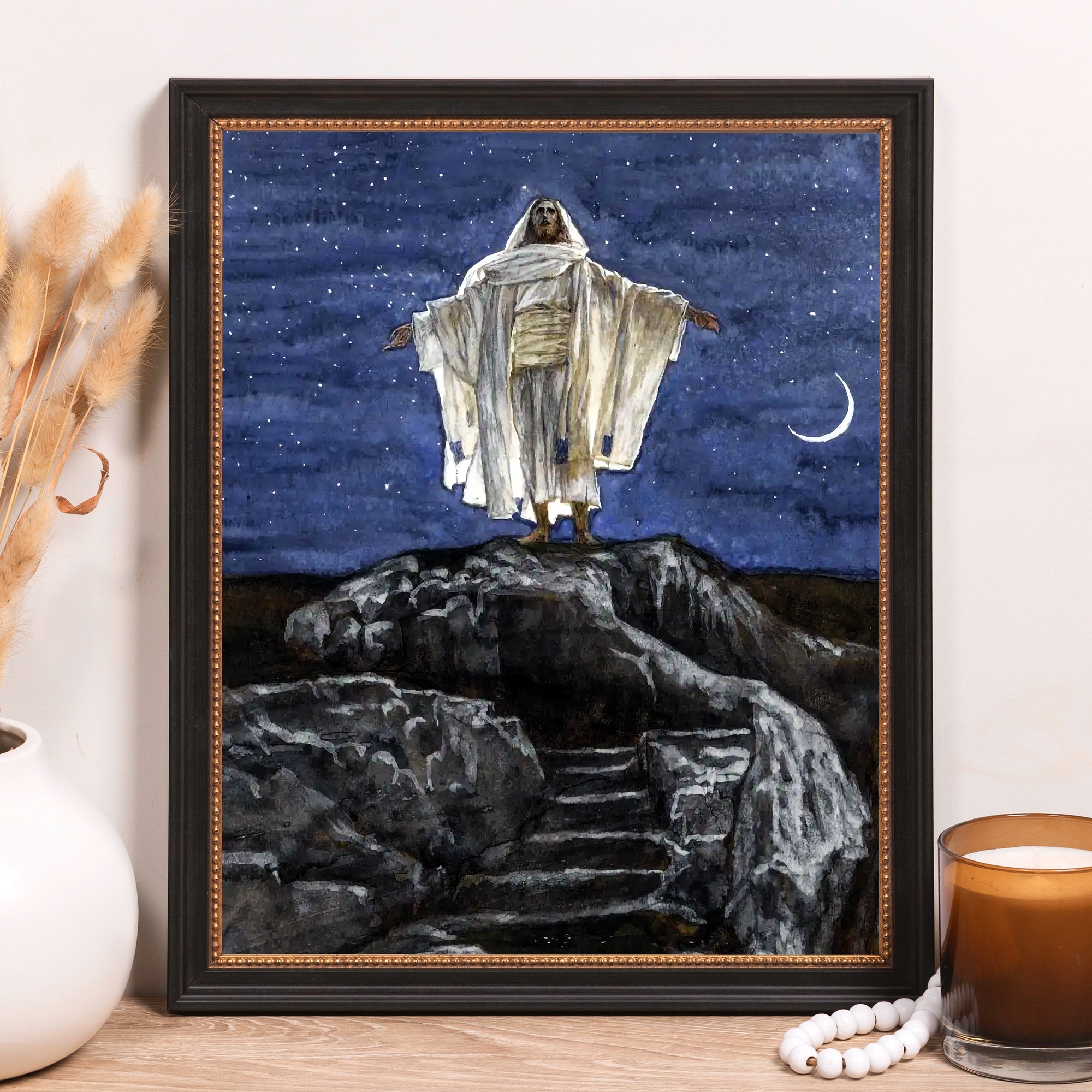 Framed painting, Jesus Christ, in flowing white robe, on a mountain at night, in black frame.
