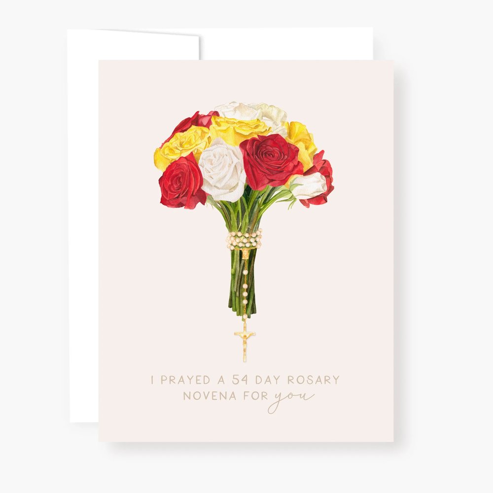 Greeting card with watercolor bouquet of red, white, and yellow roses tied with rosary beads and gold cross at the bottom.