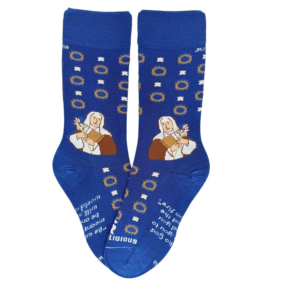 Blue socks with an illustration of Saint Therese, crowns, and religious text in white and yellow.